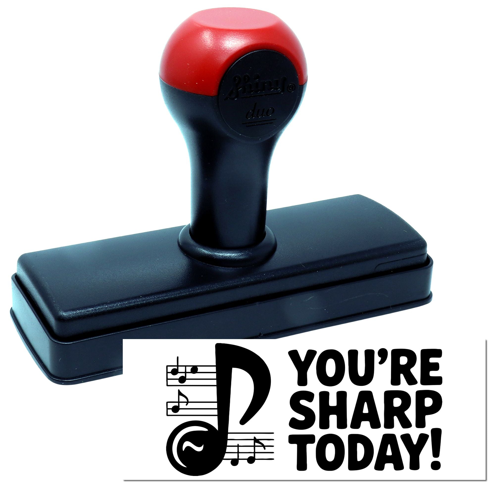 Red and black self-inking rubber stamp with music-note seal reading "You're Sharp Today!"