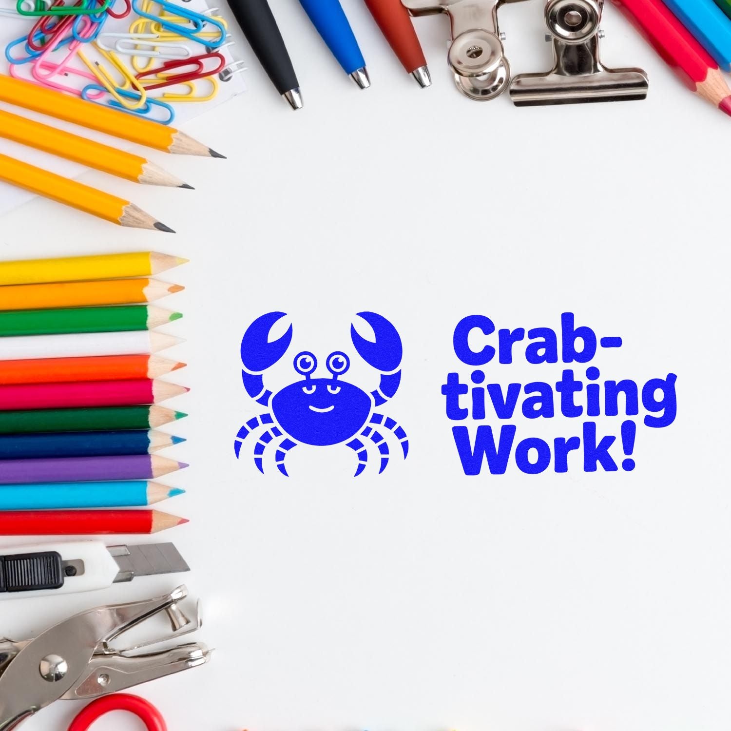 Blue crab stamp and seal with Crab-tivating Work! on white, framed by colorful pencils, clips, and office tools.
