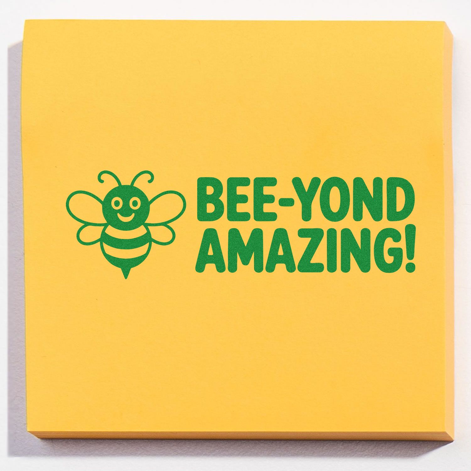 Yellow stamp pad with green bee logo and BEE-YOND AMAZING! slogan for stamp and seal products.