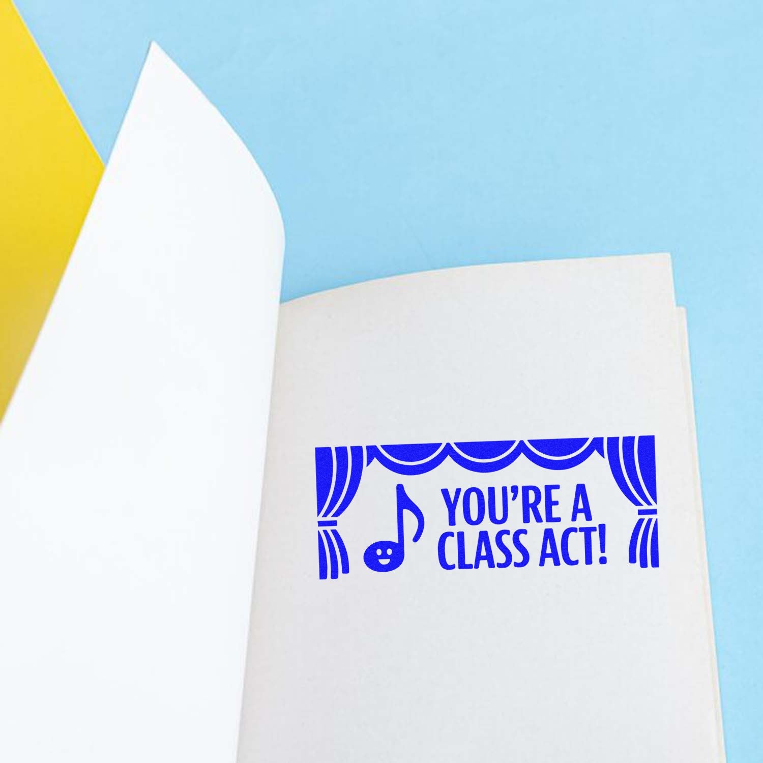 Blue Youre a Class Act! stamp seal on a white page, with yellow and sky-blue background.