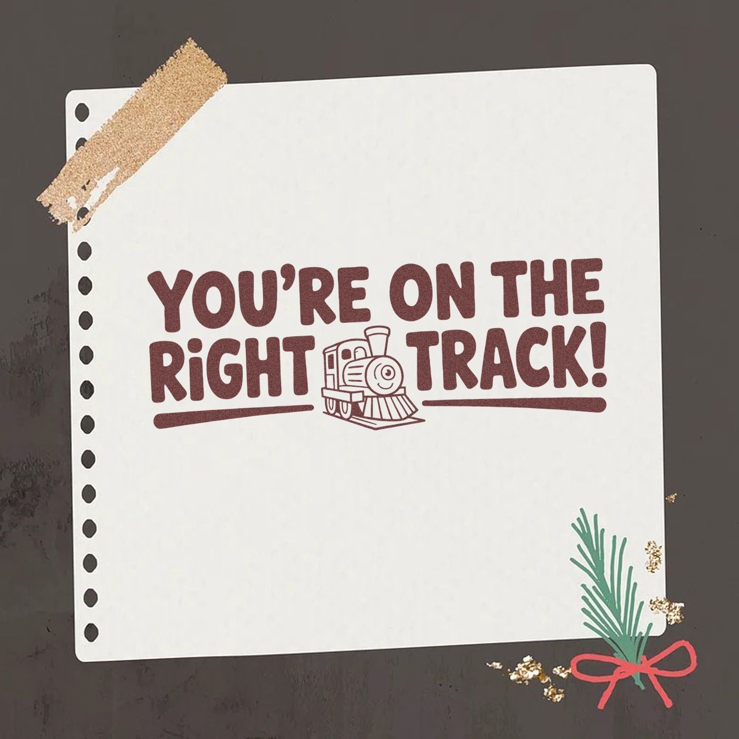 Brown stamp and seal on white paper reading Youre on the right track! with maroon text, train icon, and green-red sprig accent.