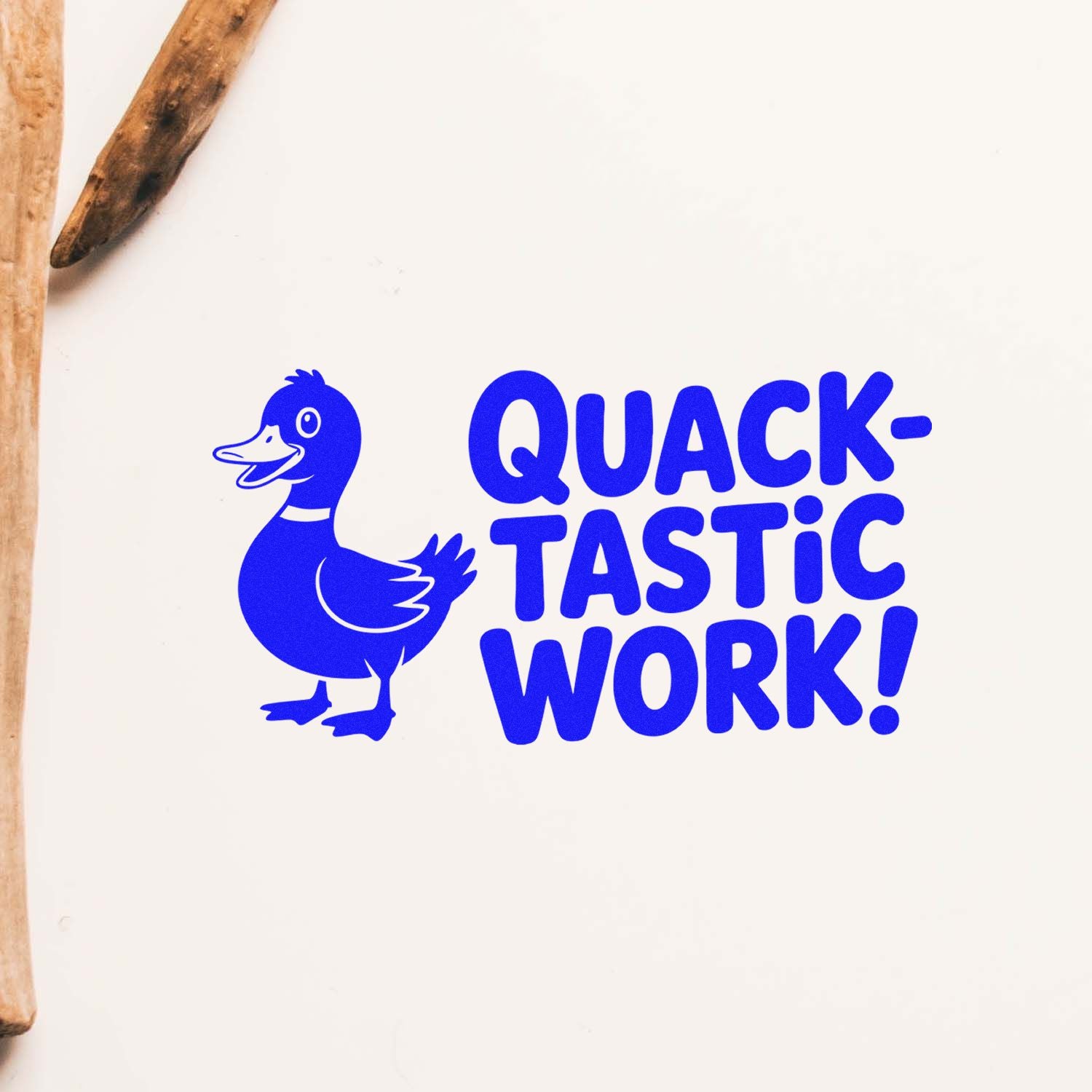 Blue duck rubber stamp/seal with QUACK-TASTIC WORK! text on white paper, beside wooden handles.