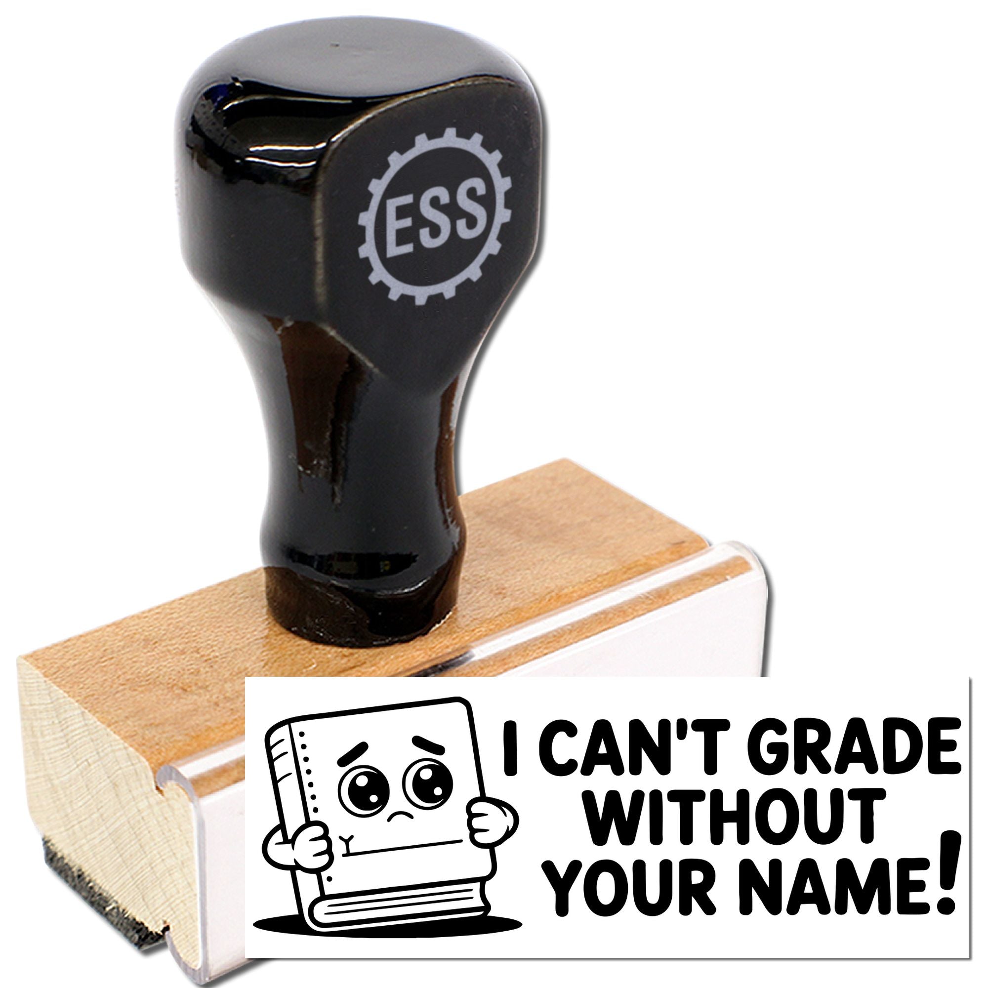 Black ESS rubber stamp and seal on wooden base with white card reading I CANT GRADE WITHOUT YOUR NAME! and cartoon book.