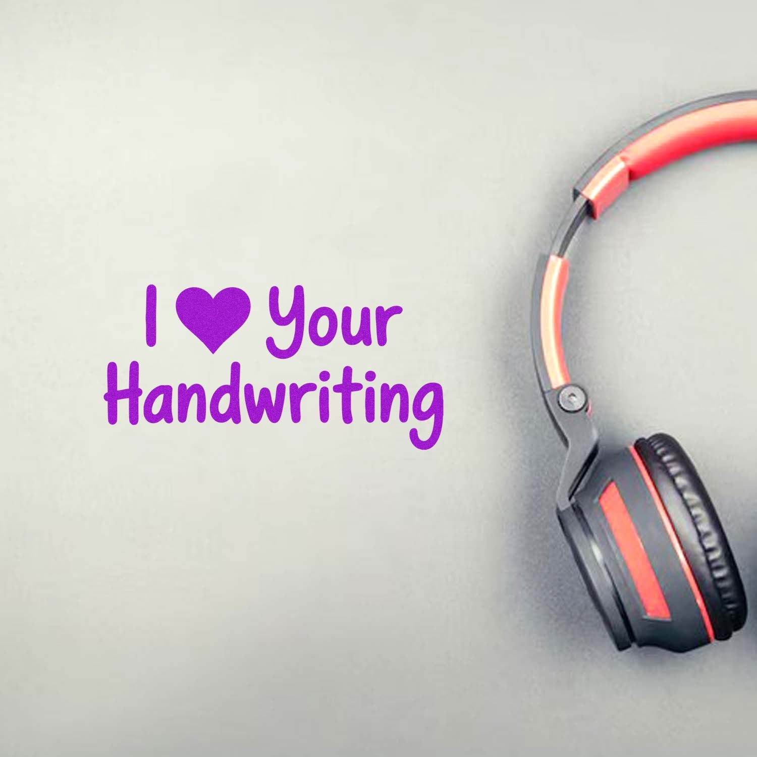 Purple custom stamp and seal design reading I ? Your Handwriting with black and red headphones on a light gray background.