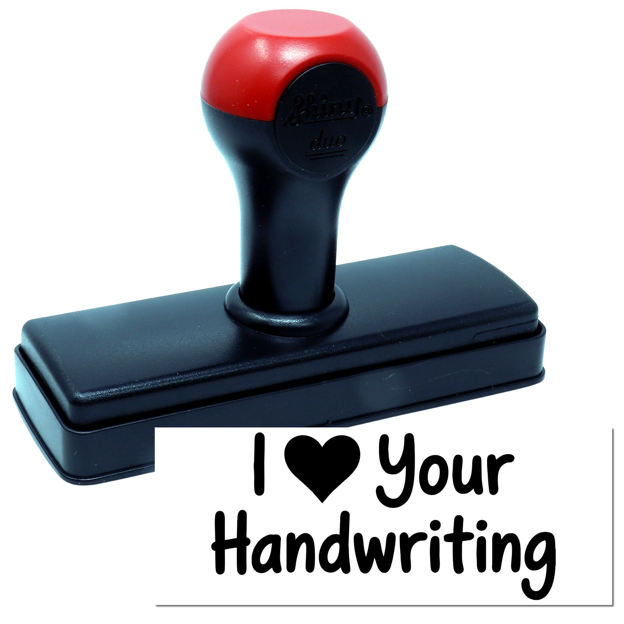 Black and red self-inking stamp with I ? Your Handwriting rubber seal on white background.