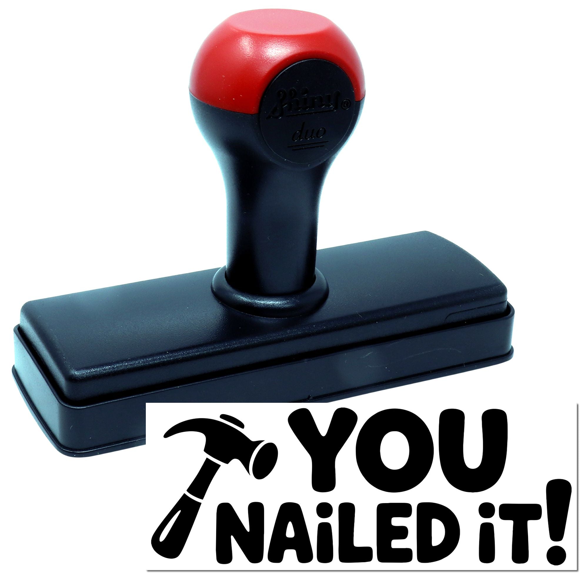 Red-and-black self-inking stamp and seal with You nailed it! text and hammer icon.