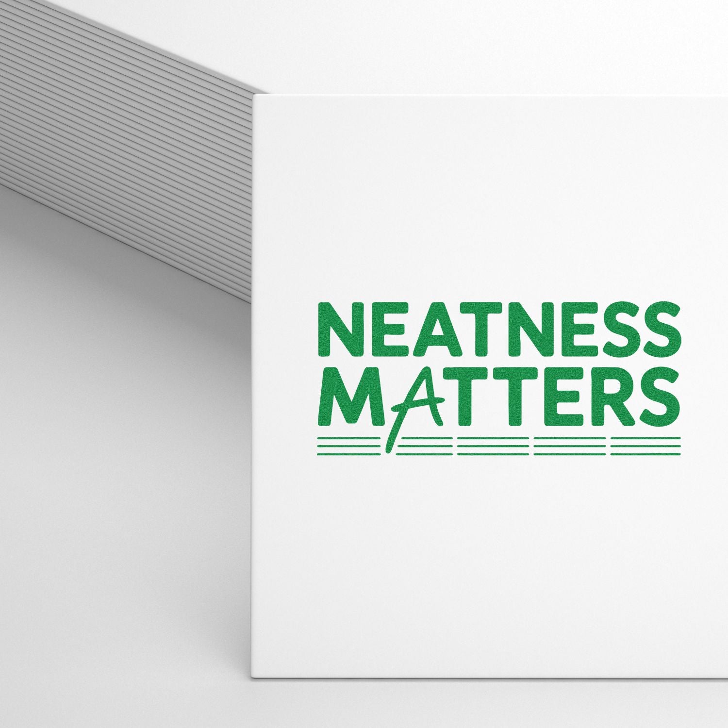 White stamp and seal product with green NEATNESS MATTERS text and gray striped background.