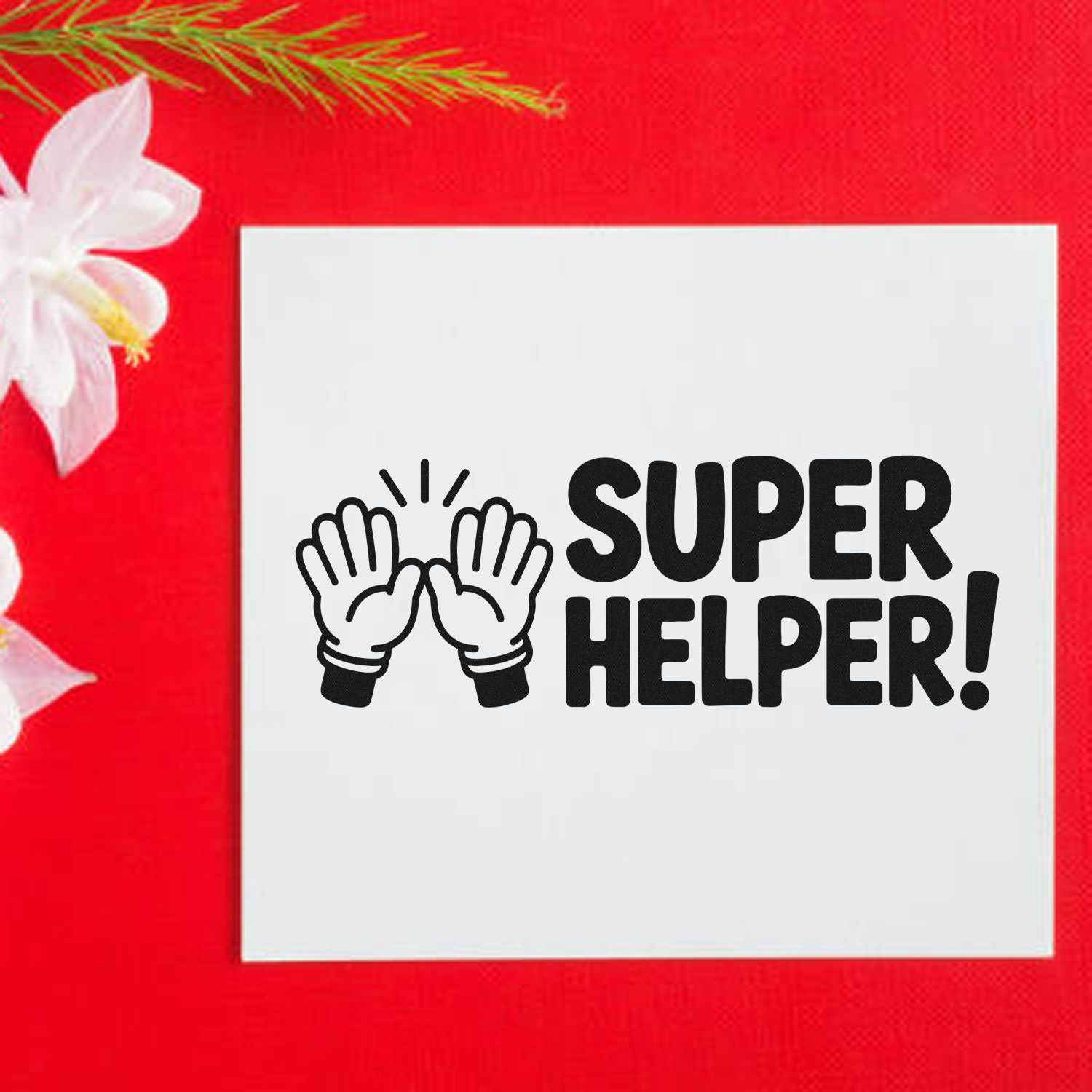 Black Super Helper stamp and seal design with clapping hands on a white square, set on a bright red background.
