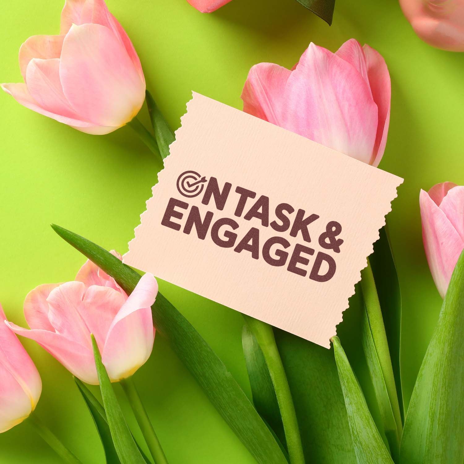 Cream stamp and seal card reading On Task & Engaged, surrounded by pink tulips on a bright green background.