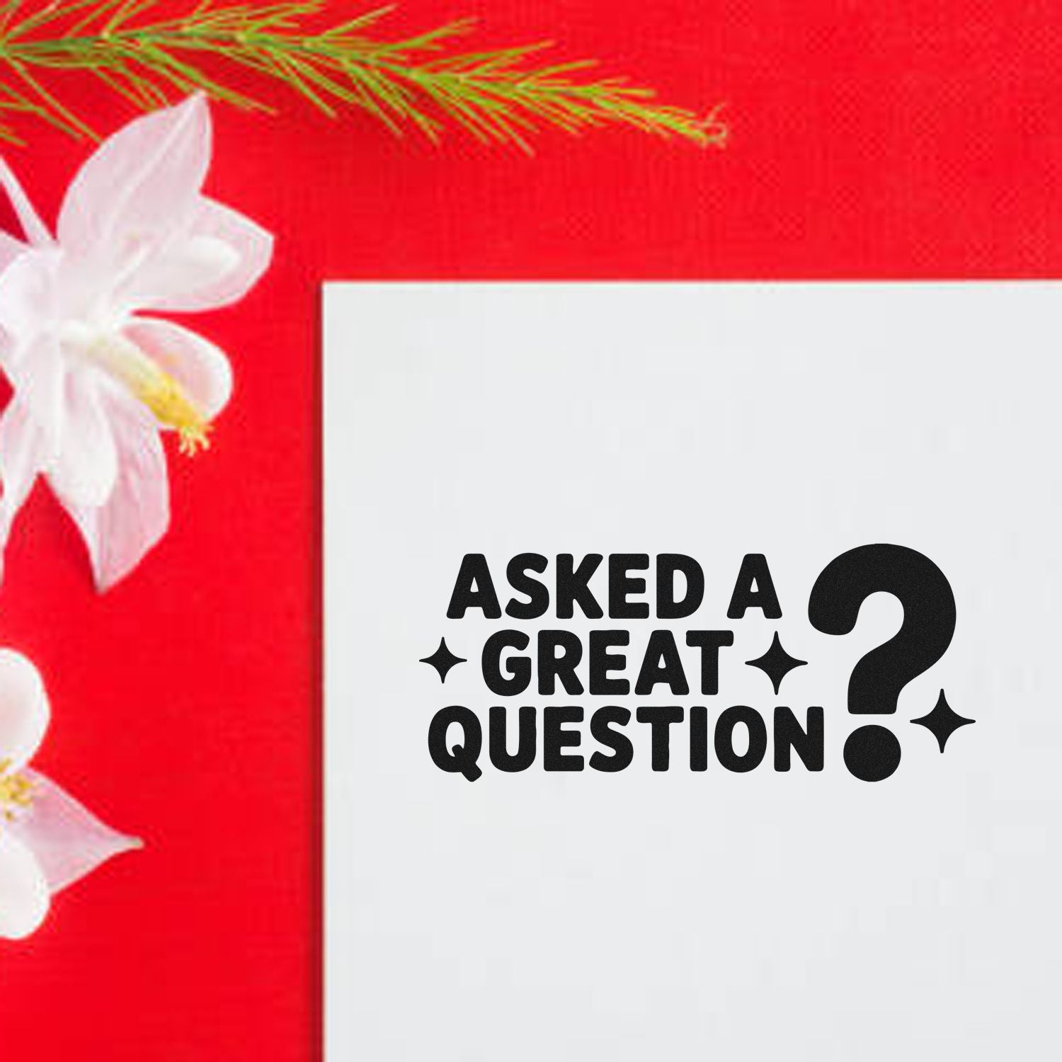 White stamp seal pad with black Asked a Great Question? text on a red background, accented by white flowers and green leaves.