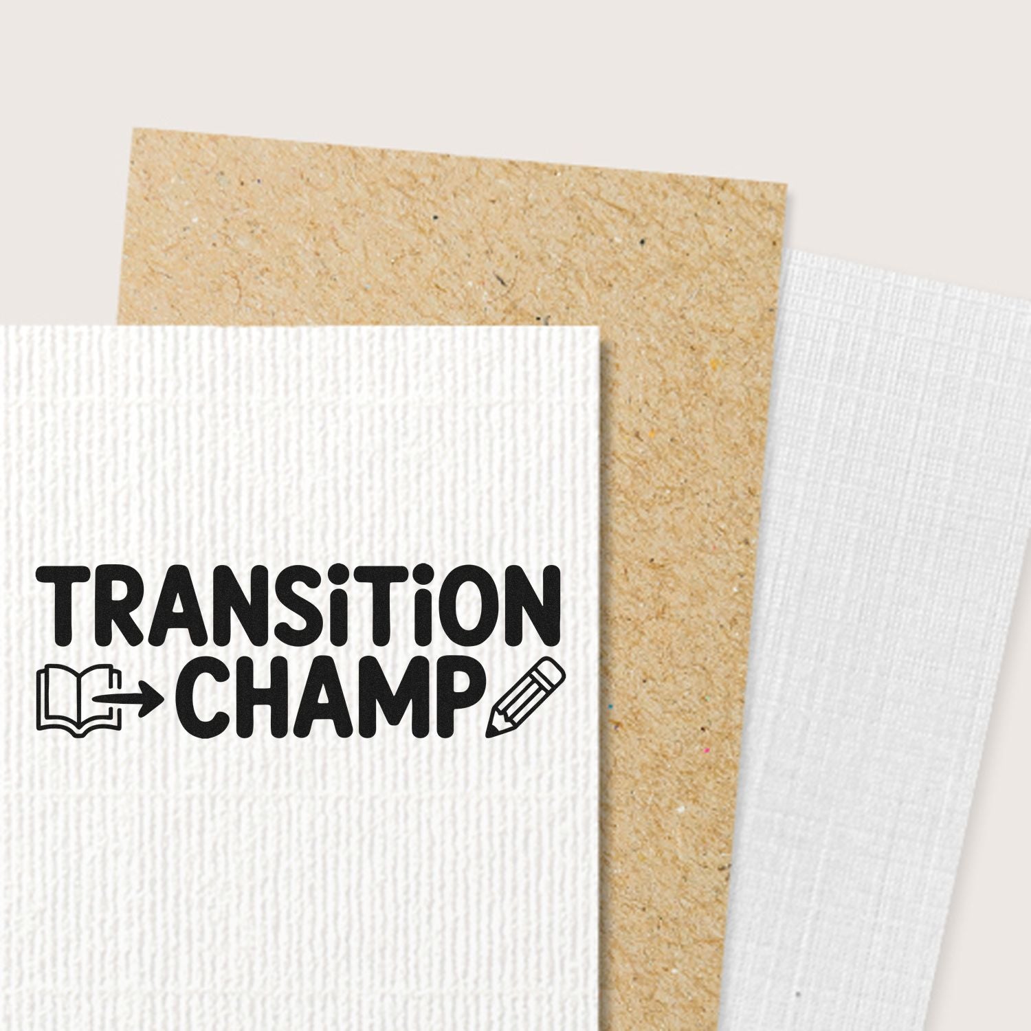 Transition Champ black stamp on white textured card, layered over tan and white stamp and seal product samples.