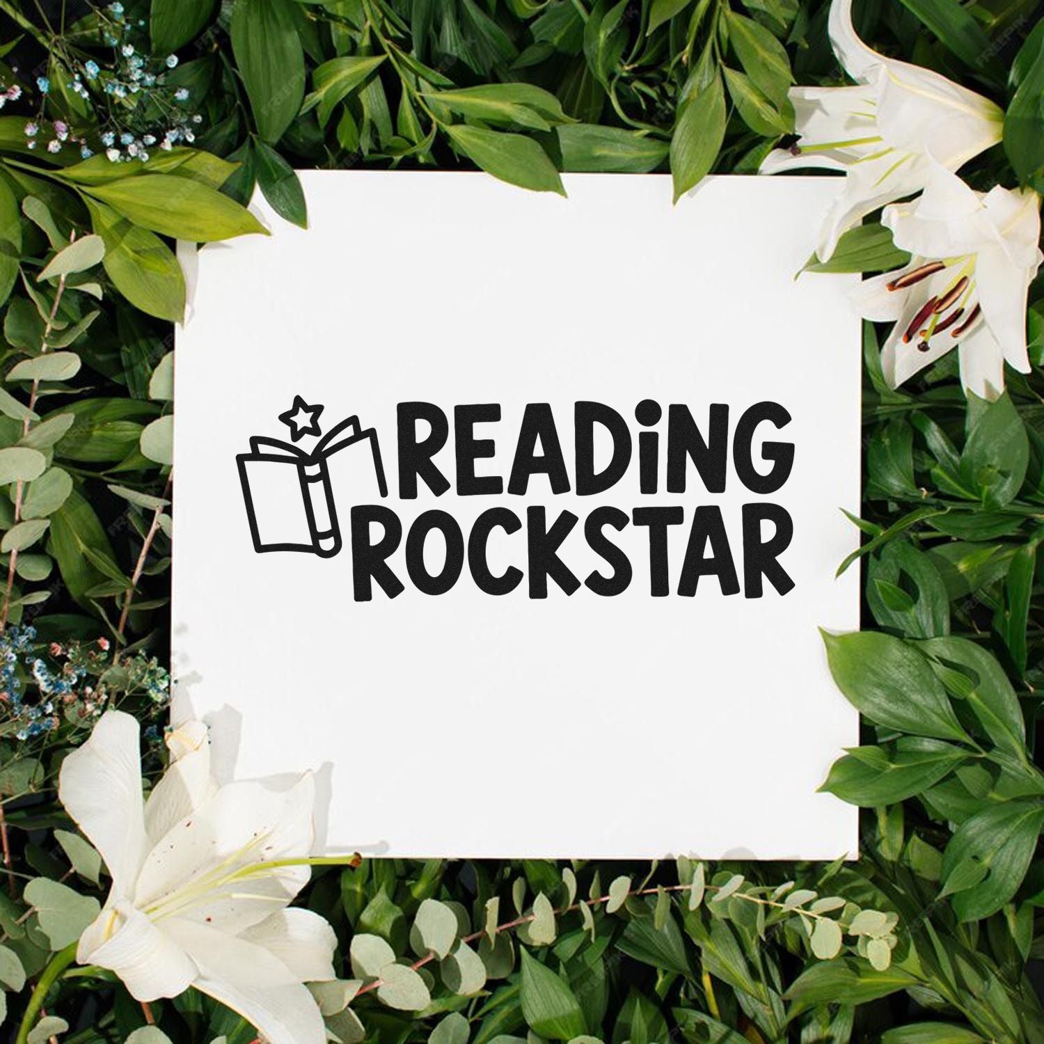 Black Reading Rockstar stamp/seal design with open-book icon on white square, framed by green leaves and white lilies.