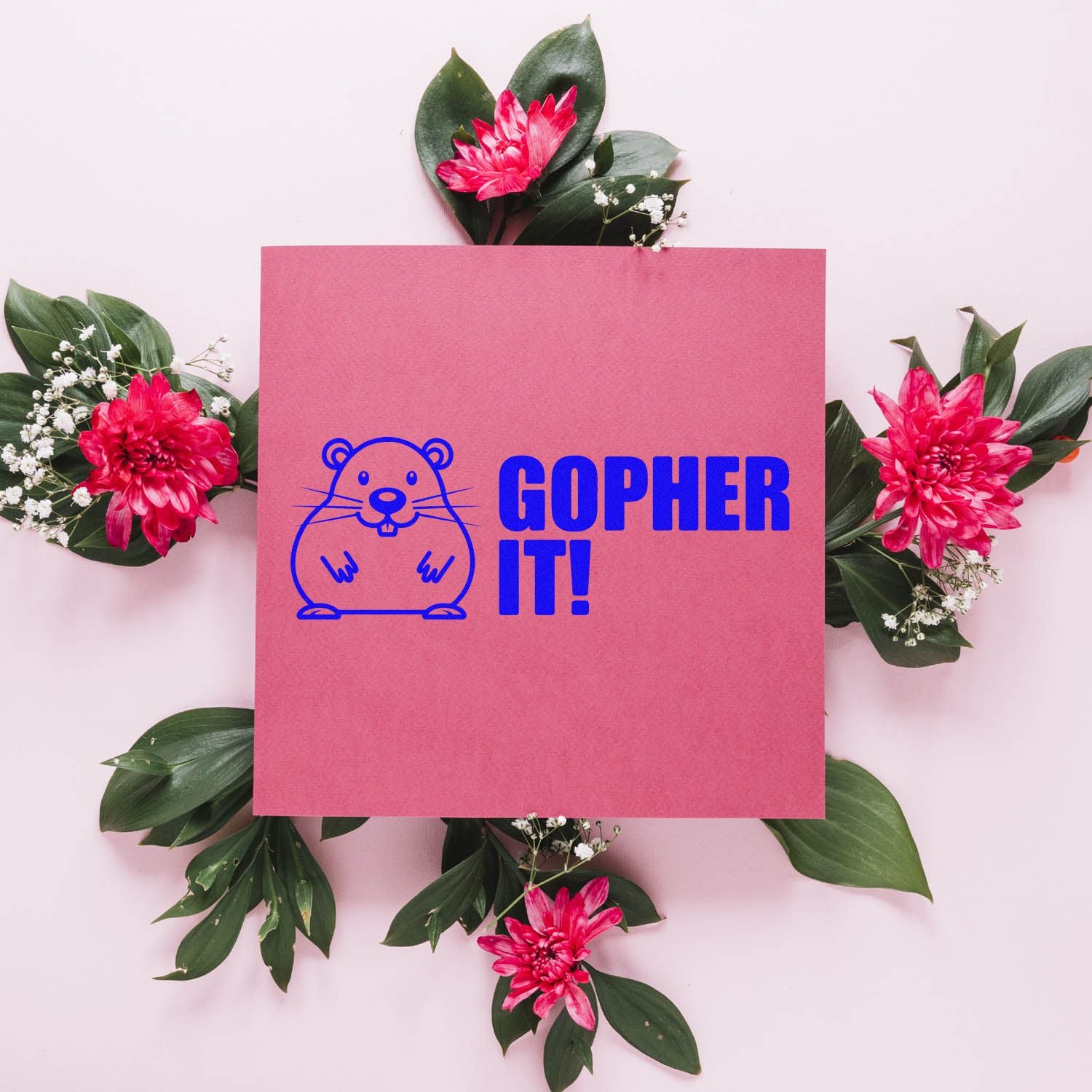Pink stamp-and-seal design with blue gopher logo and GOPHER IT! text, framed by green leaves and bright pink flowers.