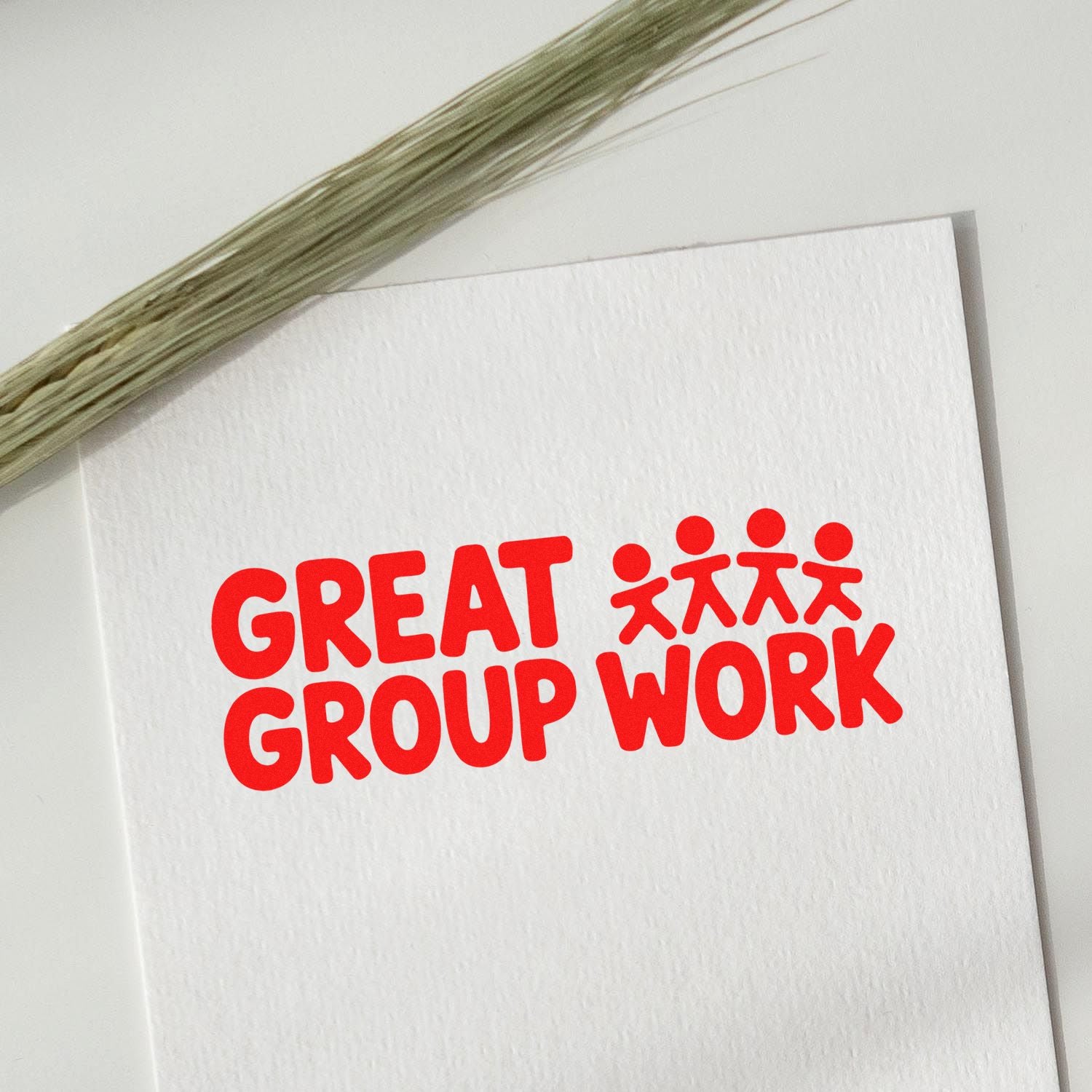 Red Great Group Work stamp with people icon on white textured paper; stamp and seal product design.