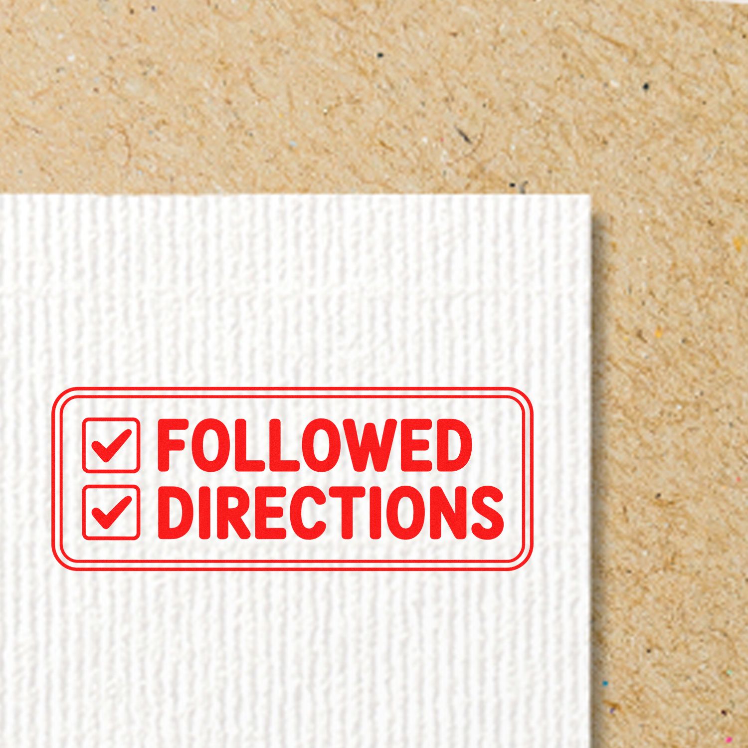 Red FOLLOWED DIRECTIONS stamp seal with checkmarks on a white textured card against a tan background