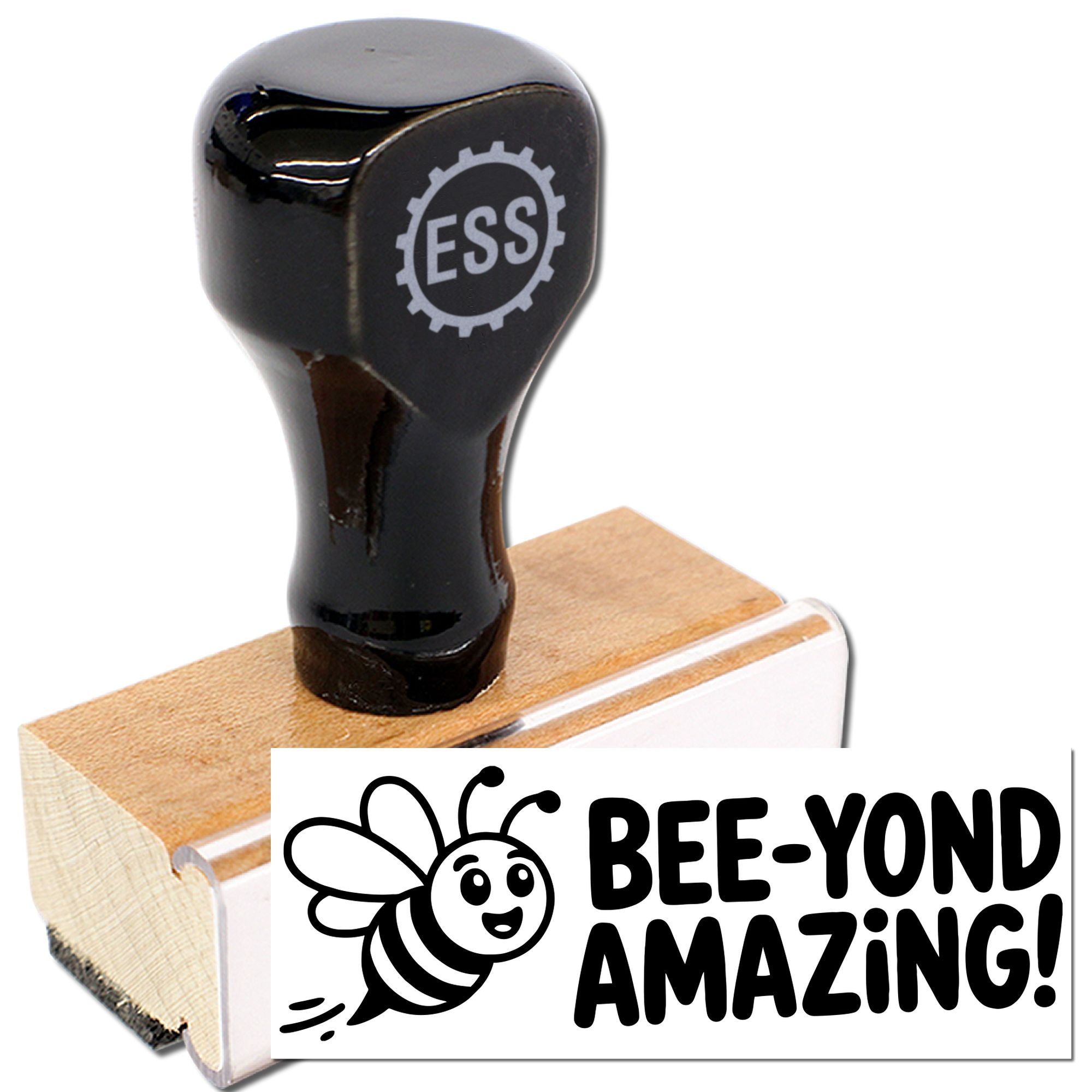 Black ESS rubber stamp on a wooden block with bee logo and bold BEE-YOND AMAZING! imprint.