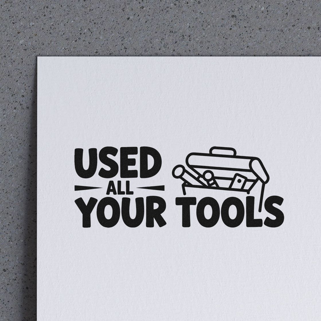 Black rubber stamp/seal reading USED ALL YOUR TOOLS with toolbox icon on white paper.