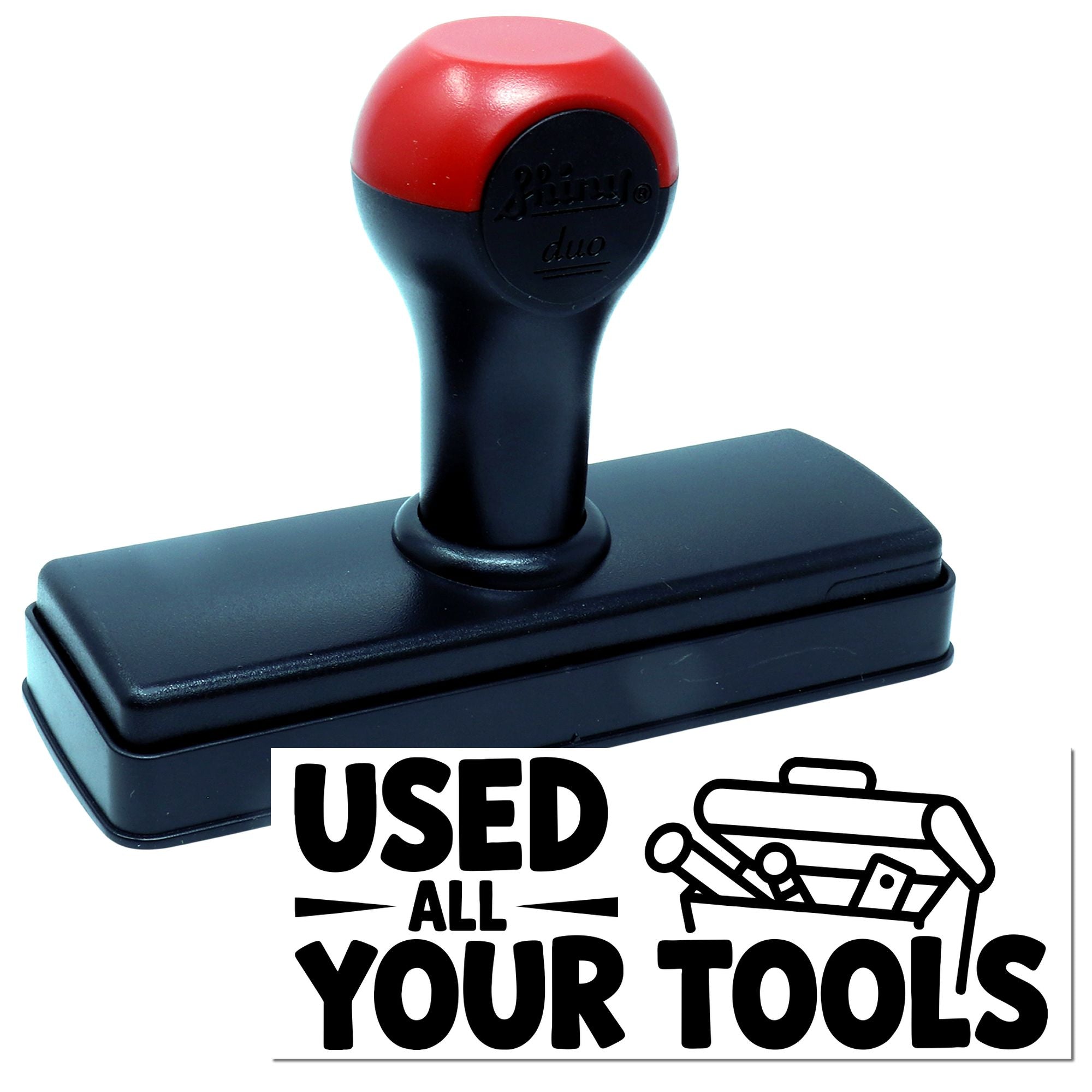 Red-and-black self-inking rubber stamp with black base and USED ALL YOUR TOOLS imprint graphic.