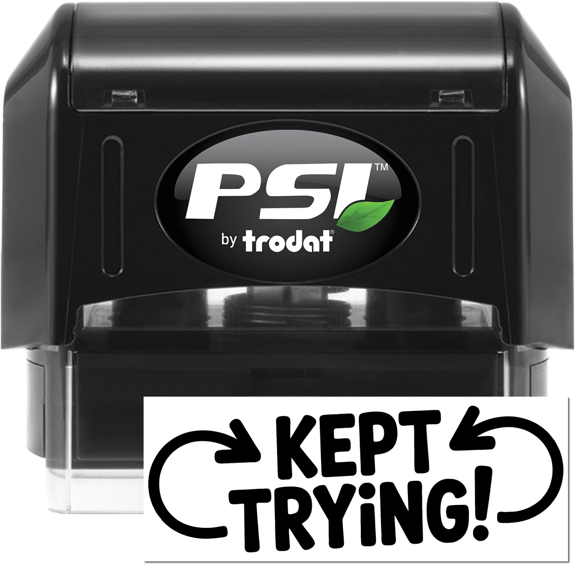 Black PSI by Trodat self-inking stamp with green leaf logo and white Kept Trying! seal.