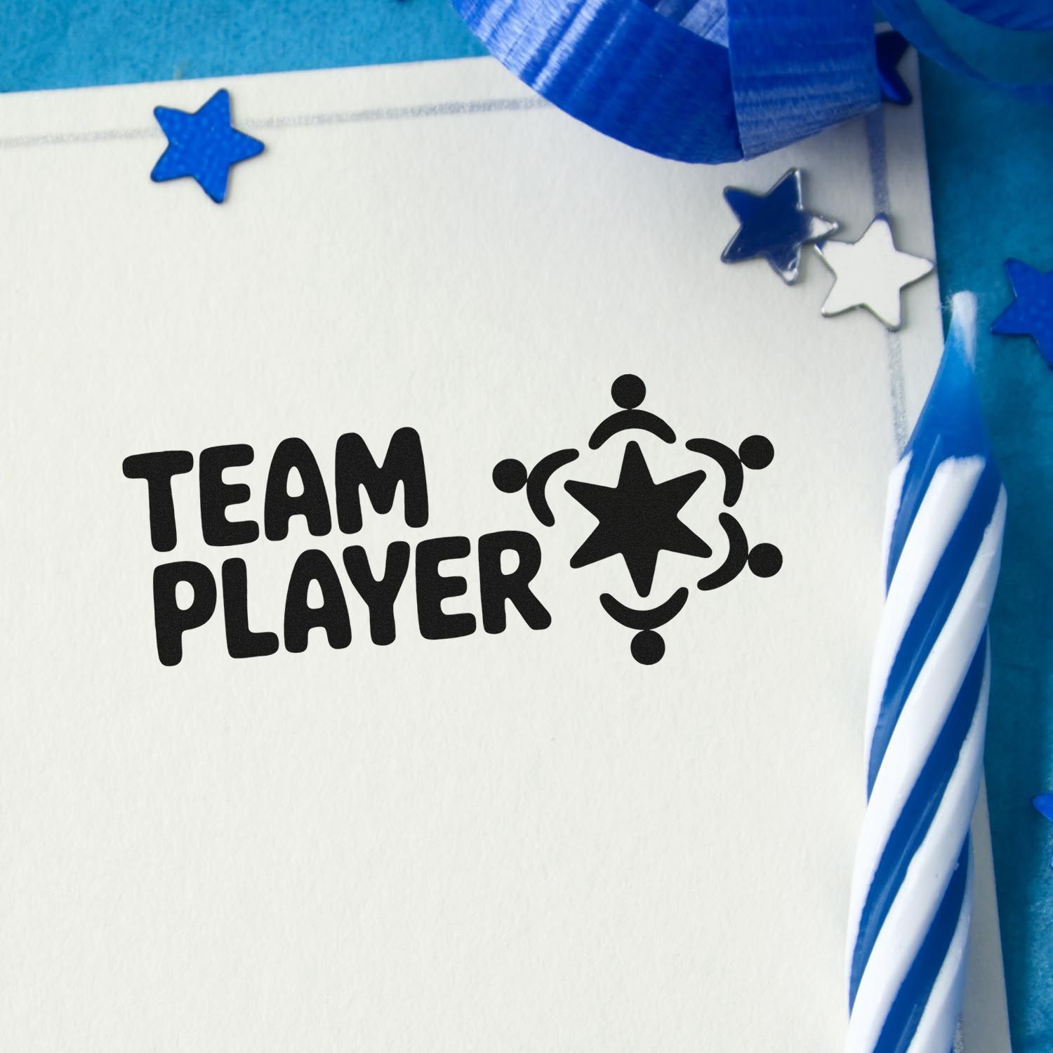 Black Team Player stamp and star seal on white paper, with blue ribbon, blue and silver star accents.