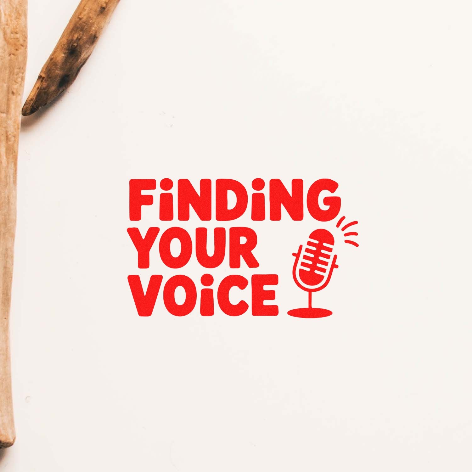 Red stamp seal reading Finding Your Voice with microphone icon on white background, framed by wooden stamp handles.