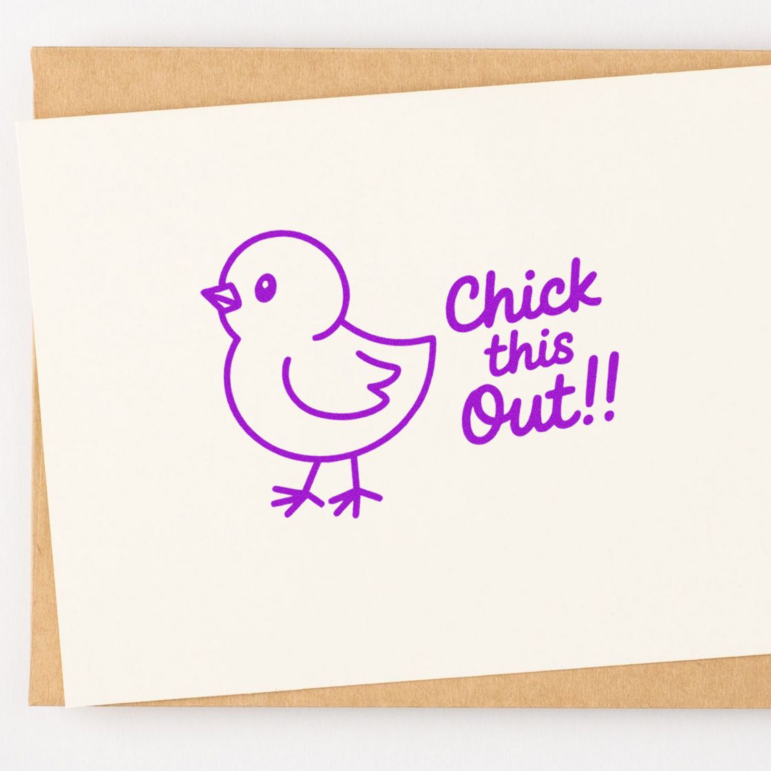 Purple chick stamp and seal with Chick this out!! on cream card over kraft paper.