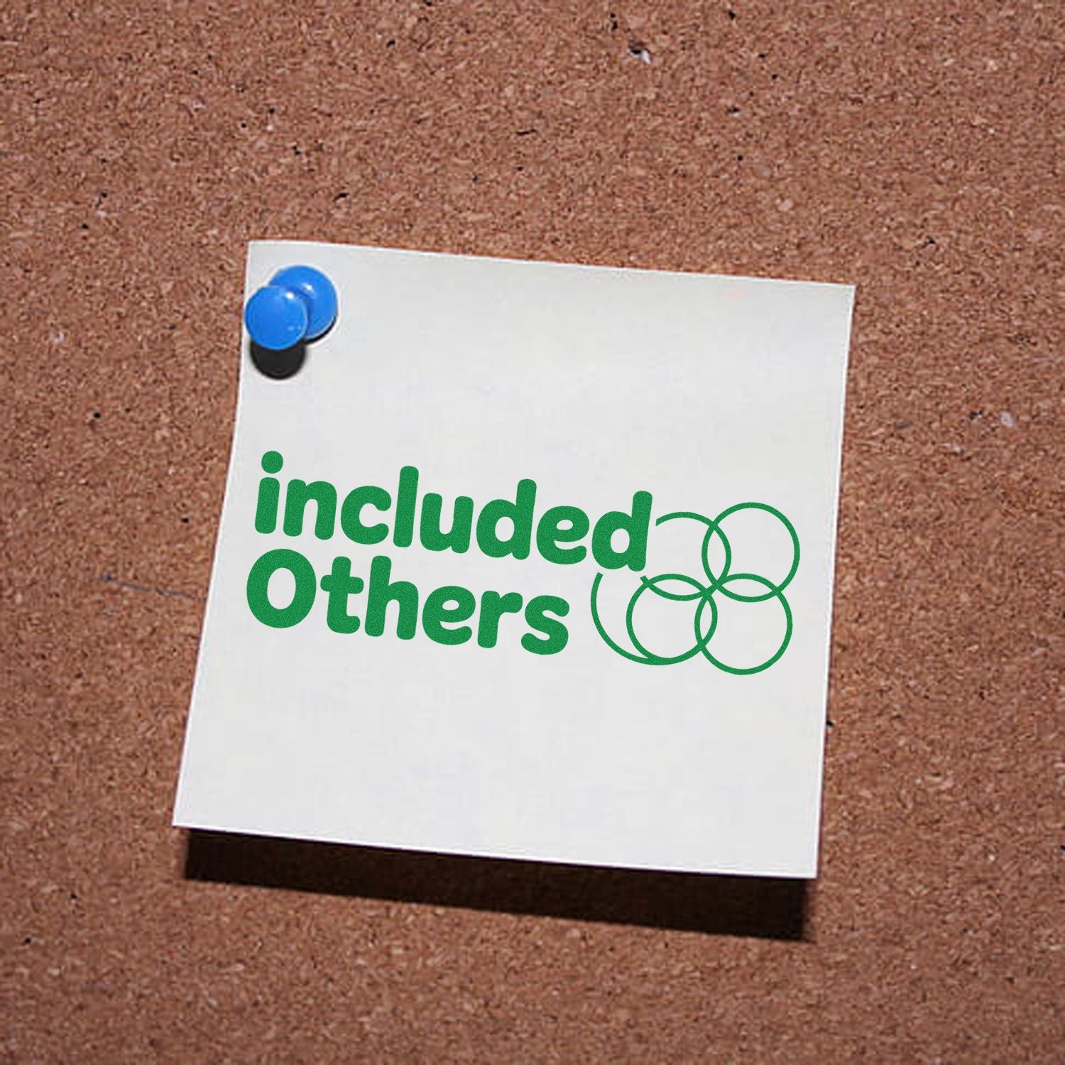 Green Included Others rubber stamp and seal graphic on a white note, pinned with a blue pushpin on corkboard.