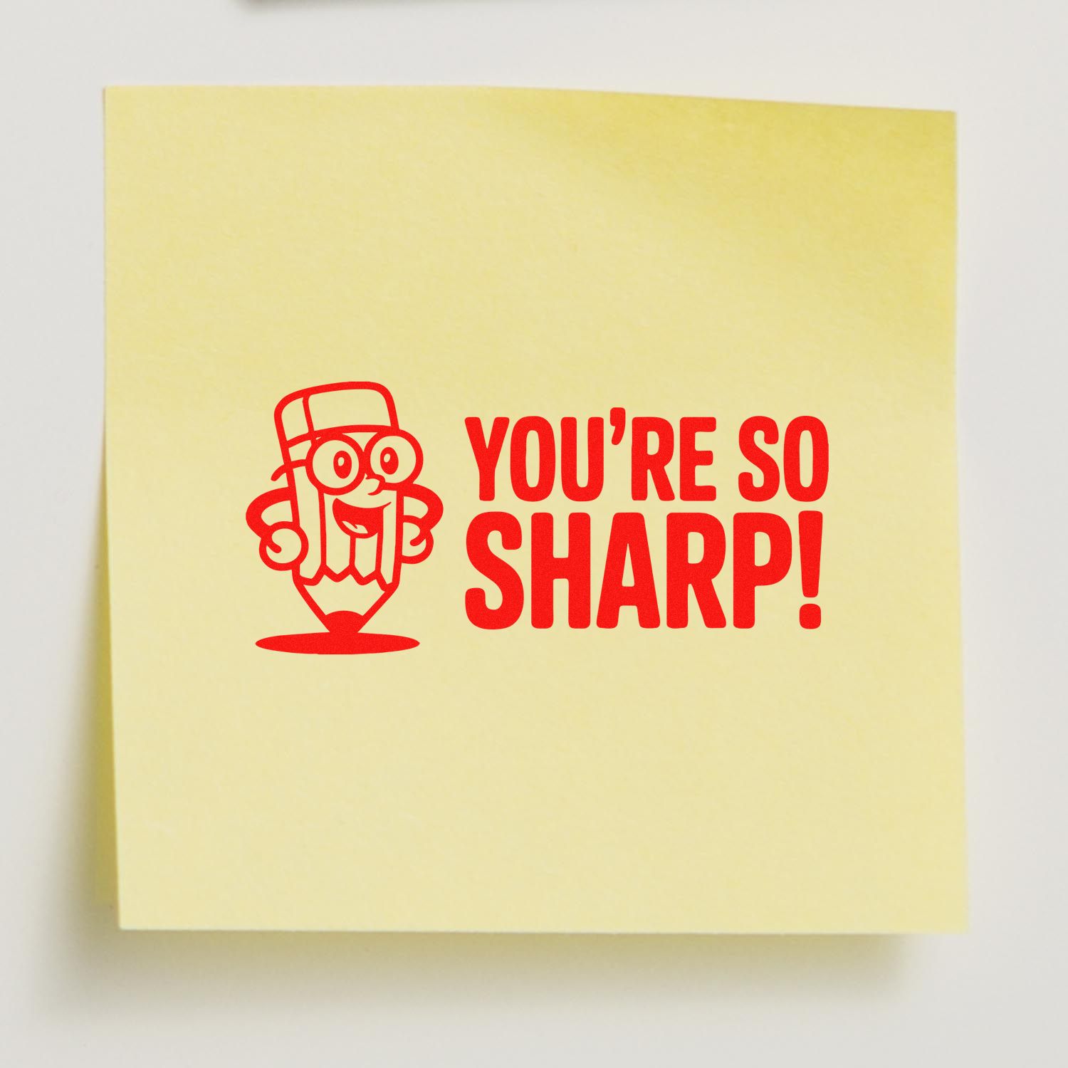 Yellow sticky note stamp with red pencil mascot and bold red YOURE SO SHARP! seal design