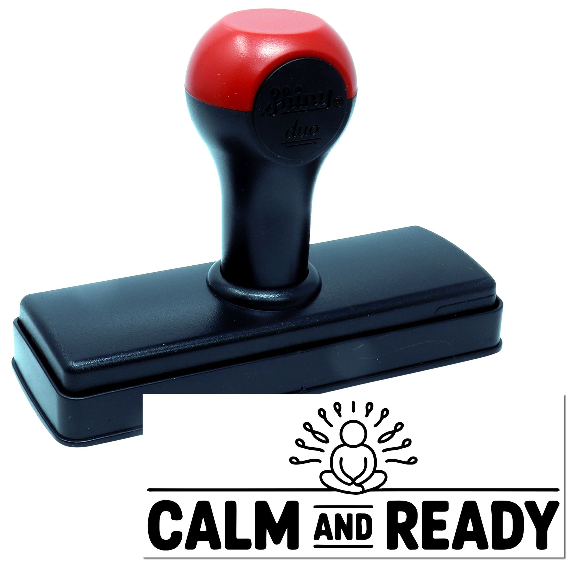 Red and black self-inking stamp and seal with rectangular base, showing a CALM AND READY imprint design.