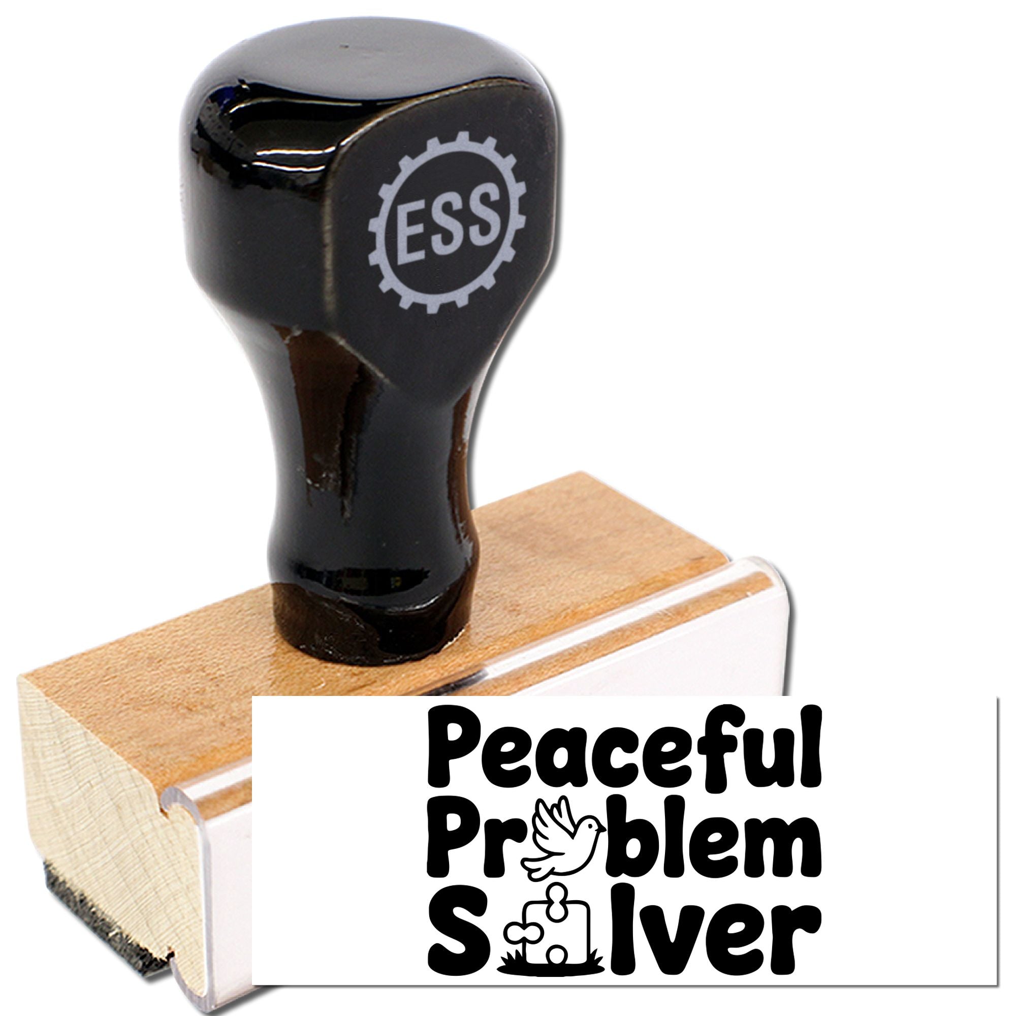 Black ESS rubber stamp seal on a wooden block, with a white label reading Peaceful Problem Solver.