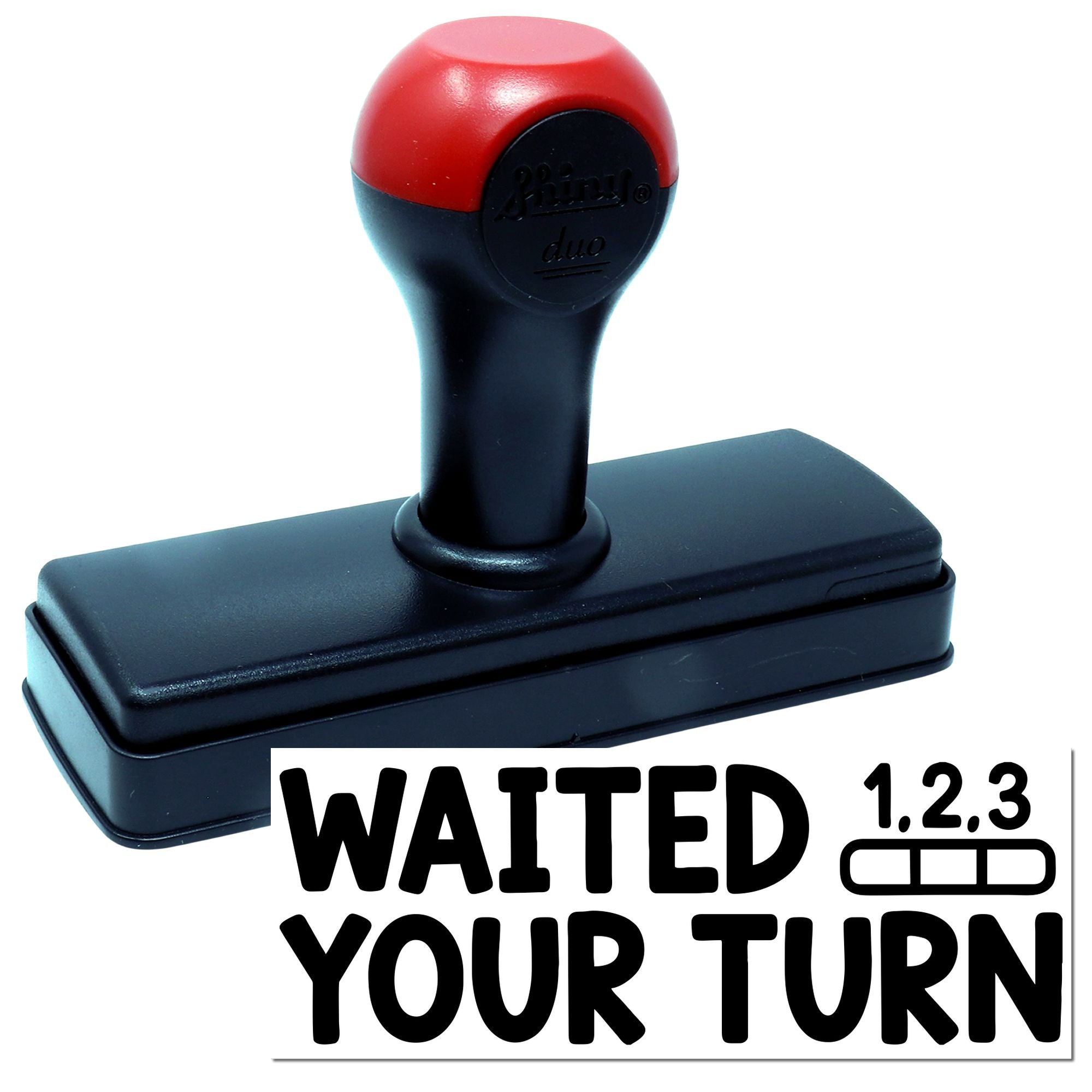 Red and black self-inking stamp with rectangular seal base and bold WAITED YOUR TURN impression.