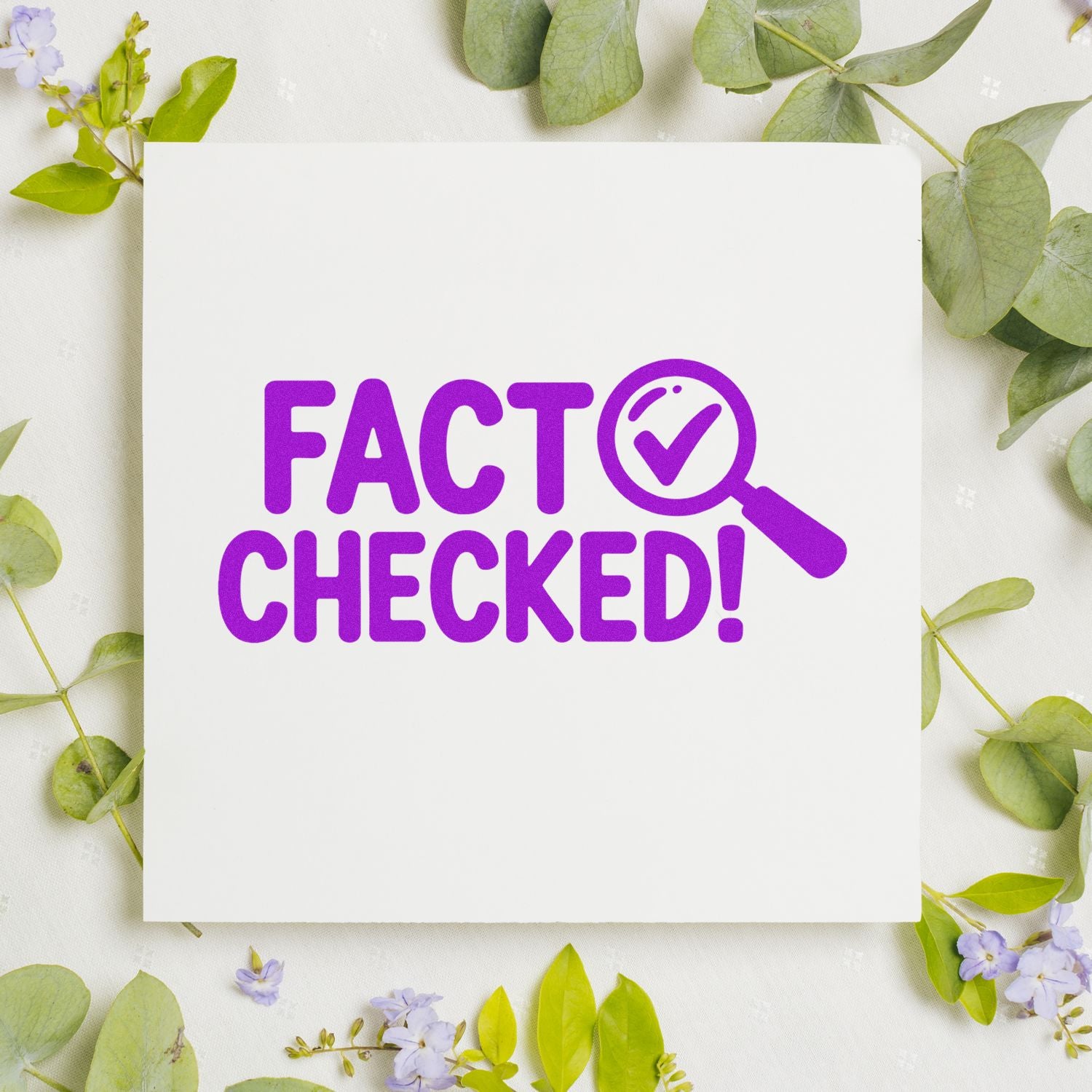 Purple Fact Checked stamp and seal on a white card, with a magnifying glass checkmark, surrounded by green leaves and lavender flowers.