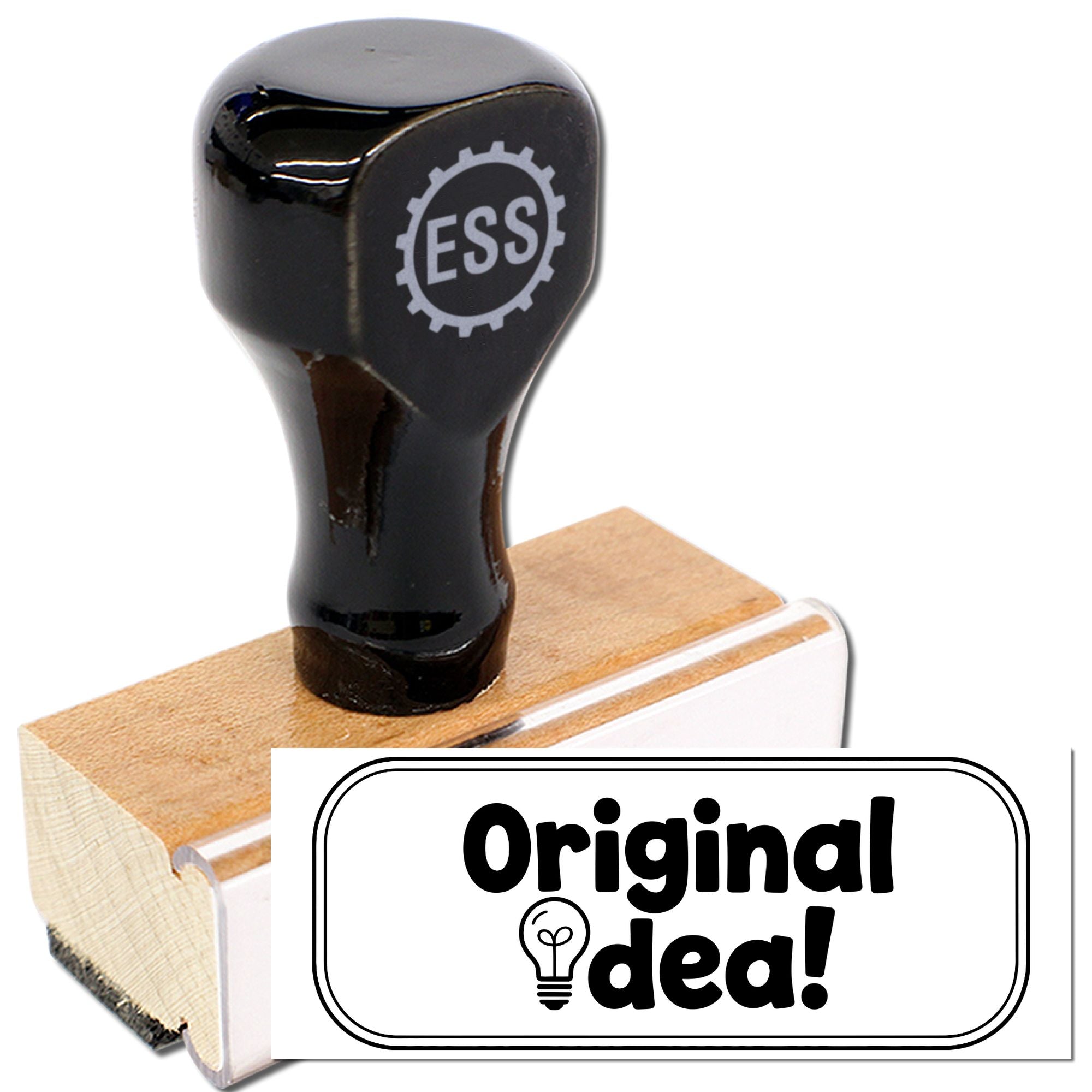 Black ESS rubber stamp with wooden handle beside white Original idea! seal on a wooden block
