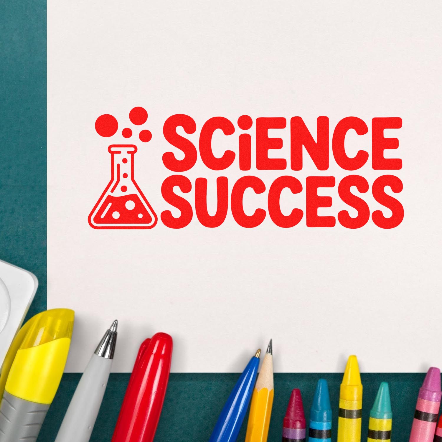 Red science success stamp and seal with flask icon on white paper, surrounded by colorful pens.