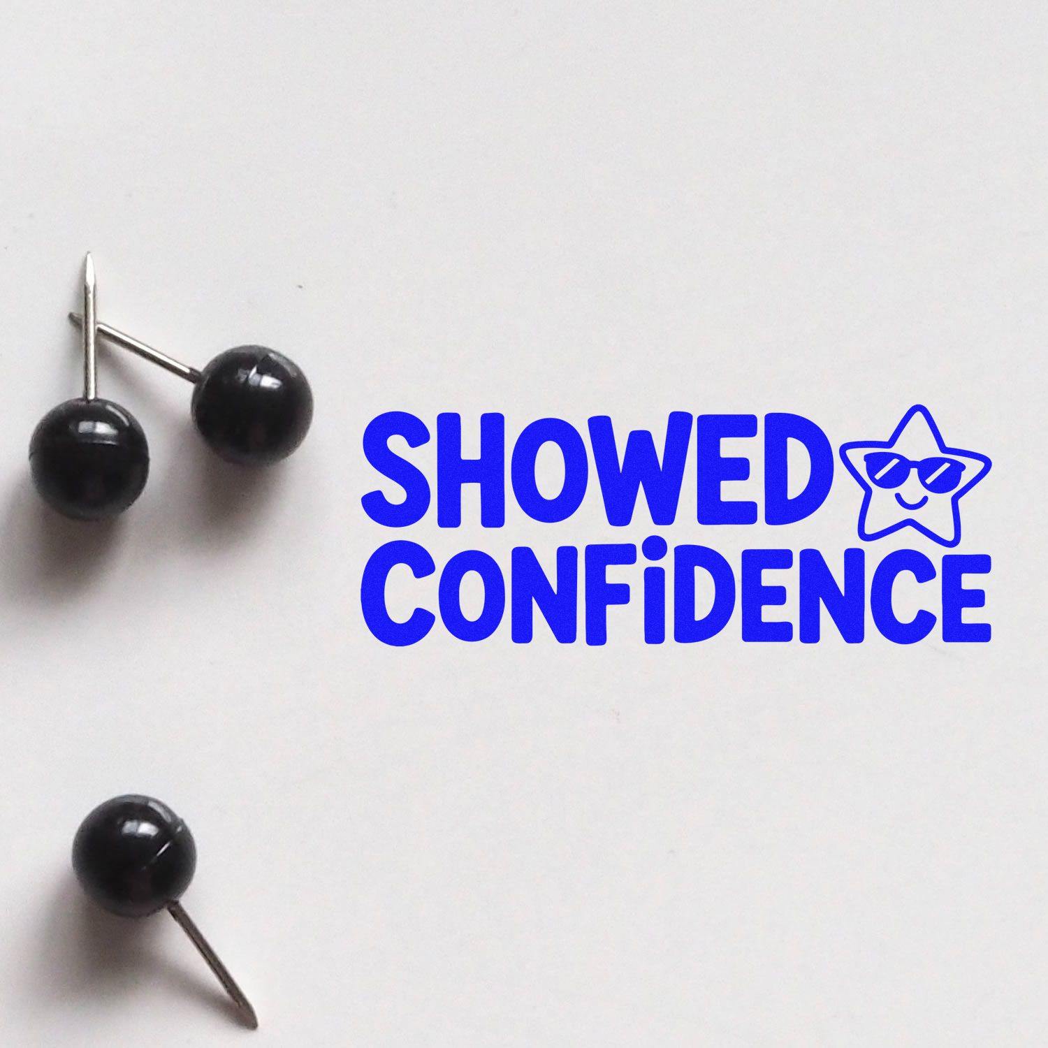 Black stamp and seal products beside bold blue SHOWED CONFIDENCE text and star logo on a white background.