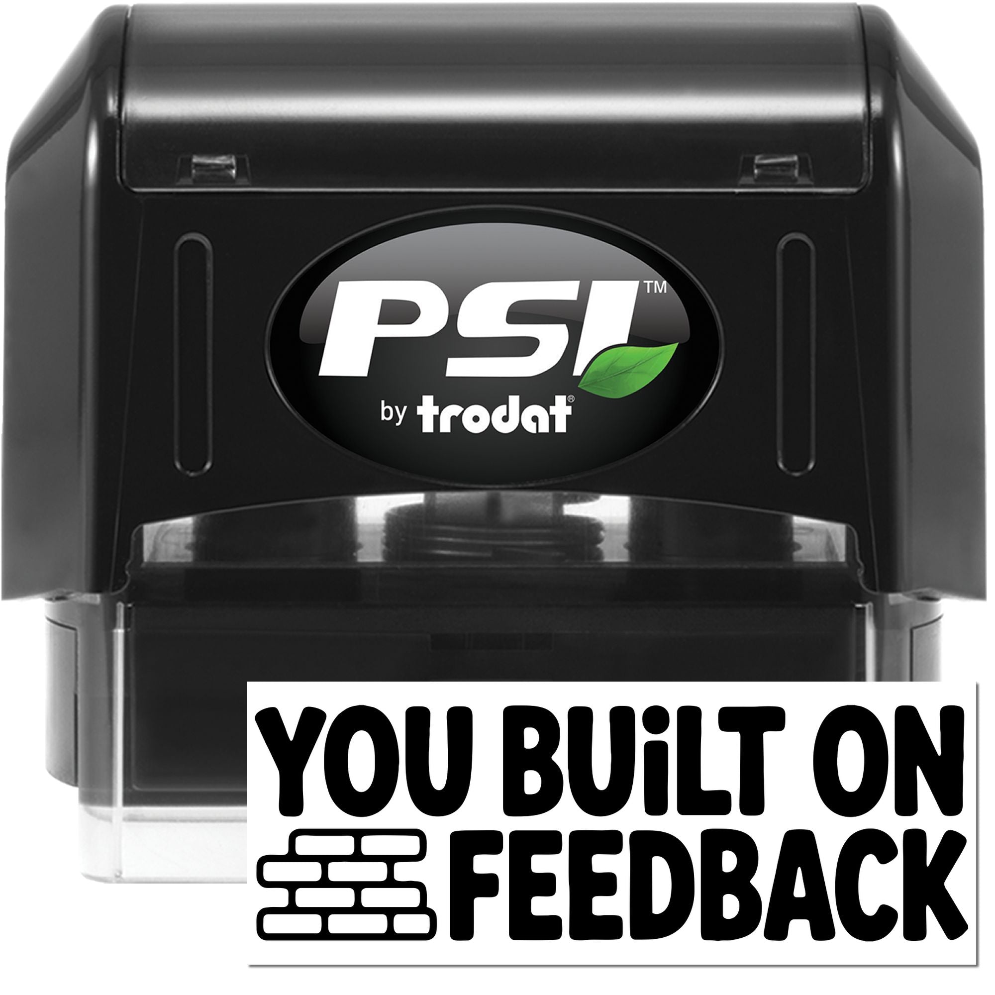 Black PSI by Trodat self-inking stamp and seal, with green leaf logo and You Built On Feedback text.