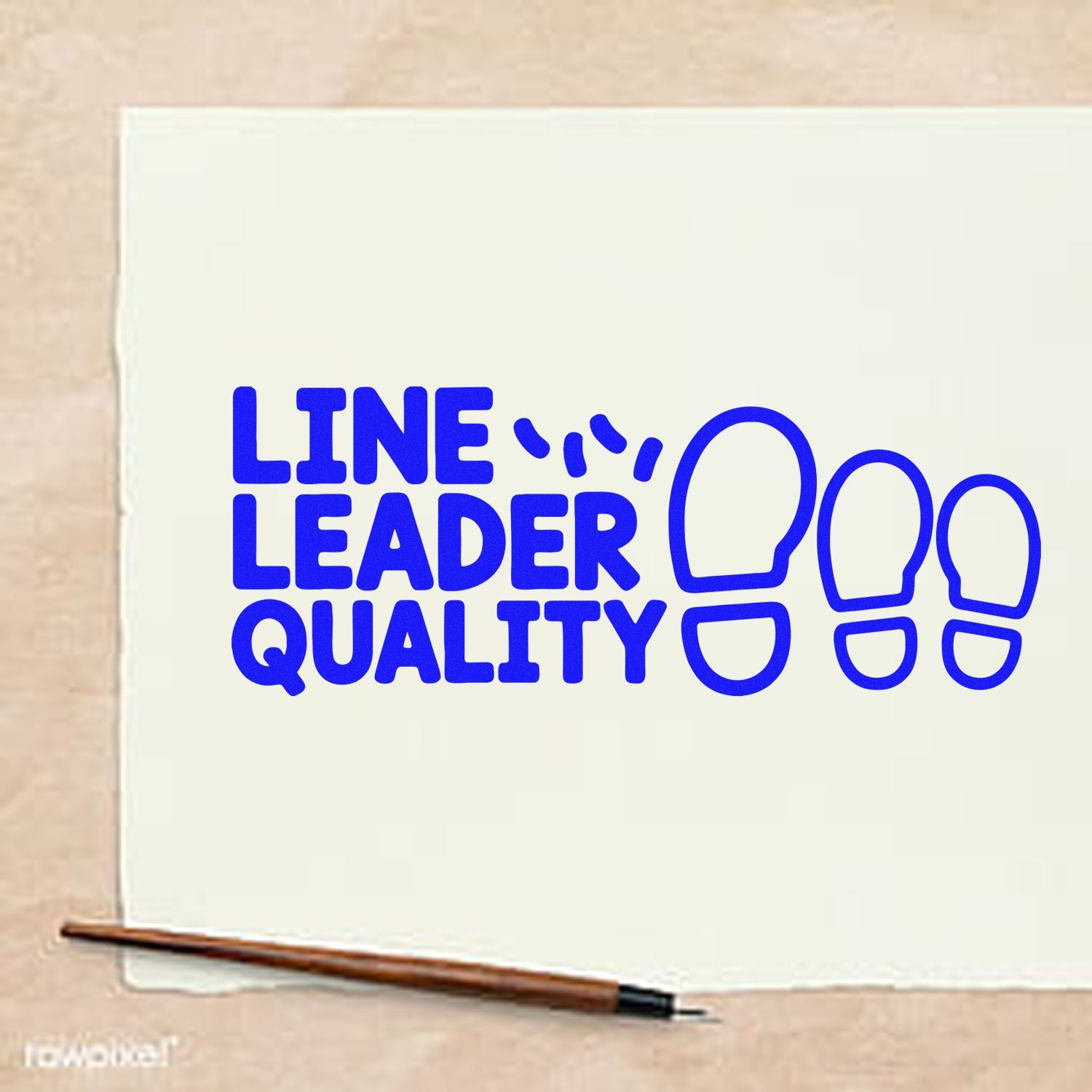Blue LINE LEADER QUALITY rubber stamp with footprint icons on cream paper, plus wooden seal handle