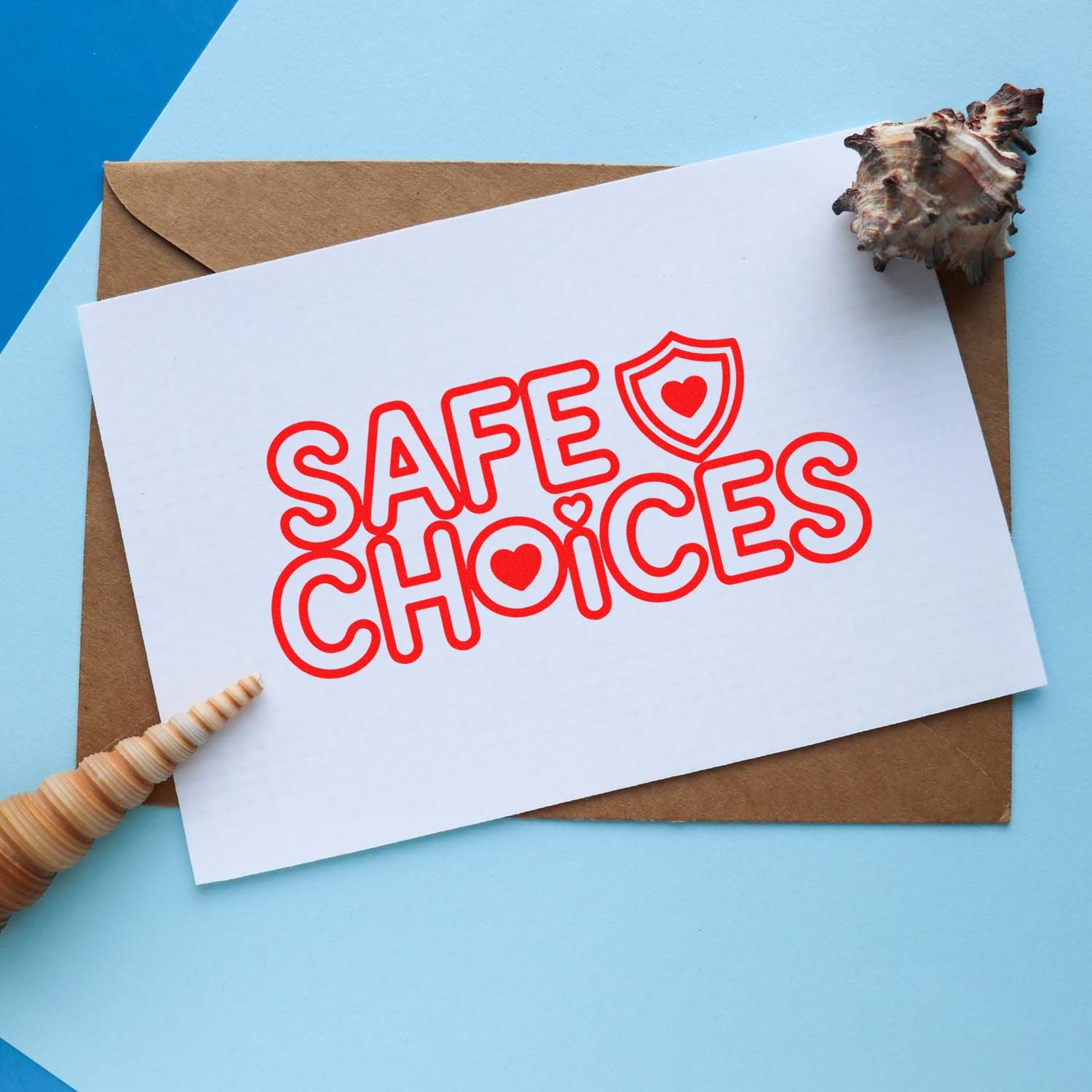 Red SAFE CHOICES stamp and seal products on white card, with heart shield icon, tan envelope, and blue background.