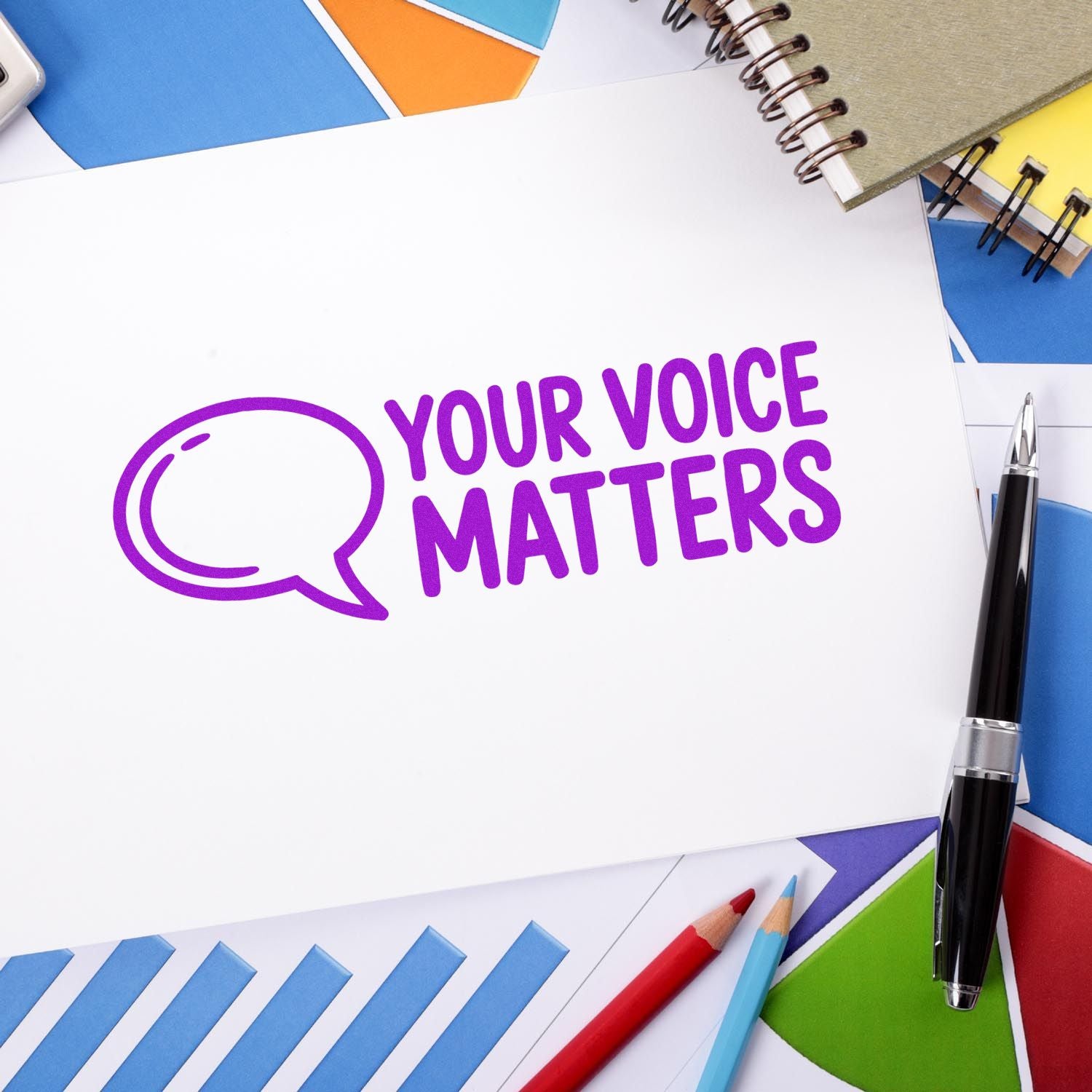 Purple Your Voice Matters stamp on white paper, surrounded by colorful seal-style stationery and pens.