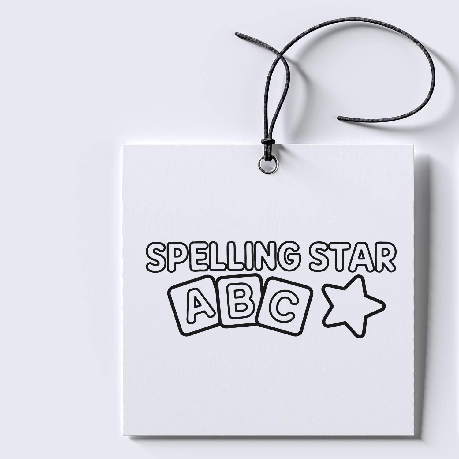 Black-and-white stamp and seal card with black cord, Spelling Star text, ABC blocks, and star outline.