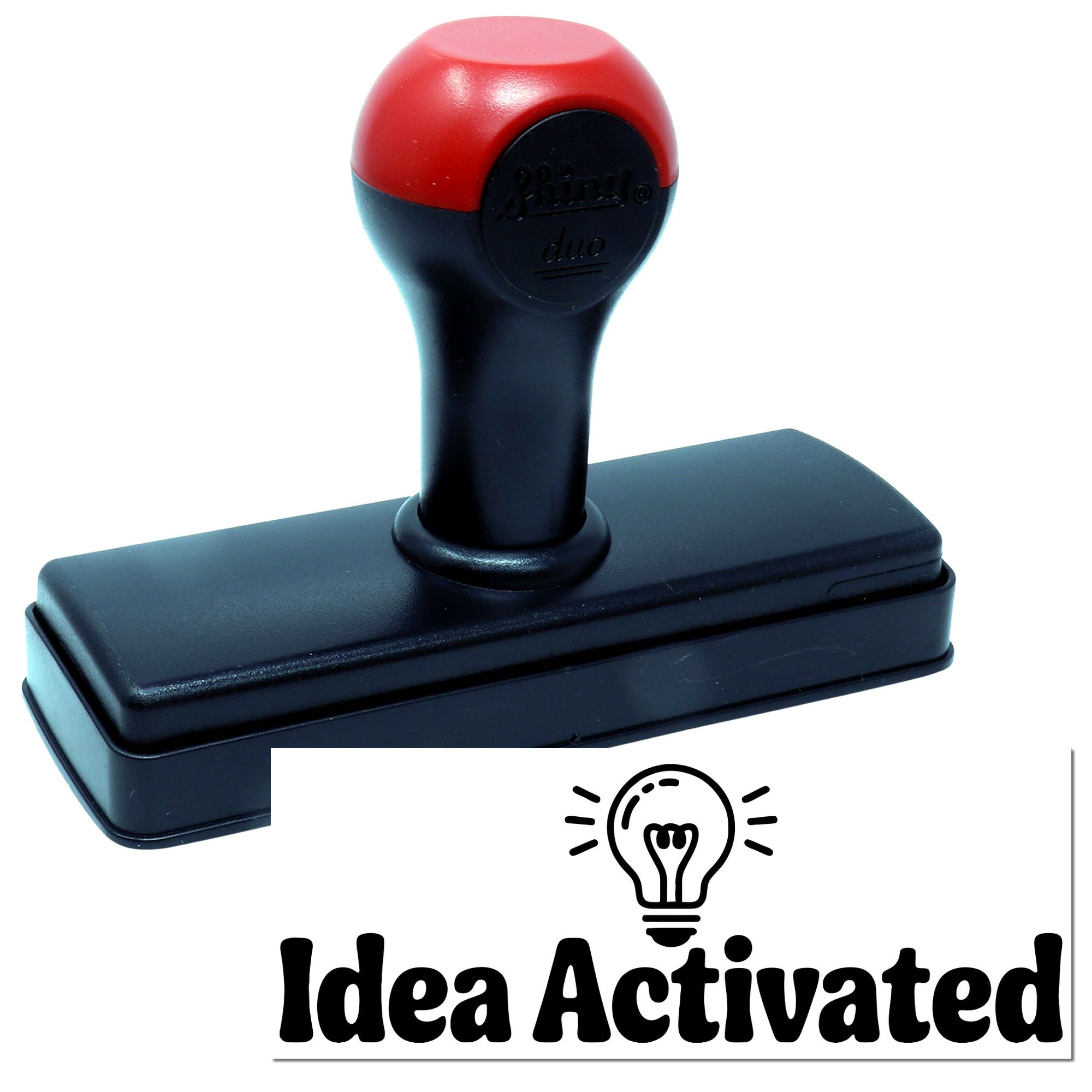 Red-and-black self-inking stamp and seal product on a black base, branded Idea Activated
