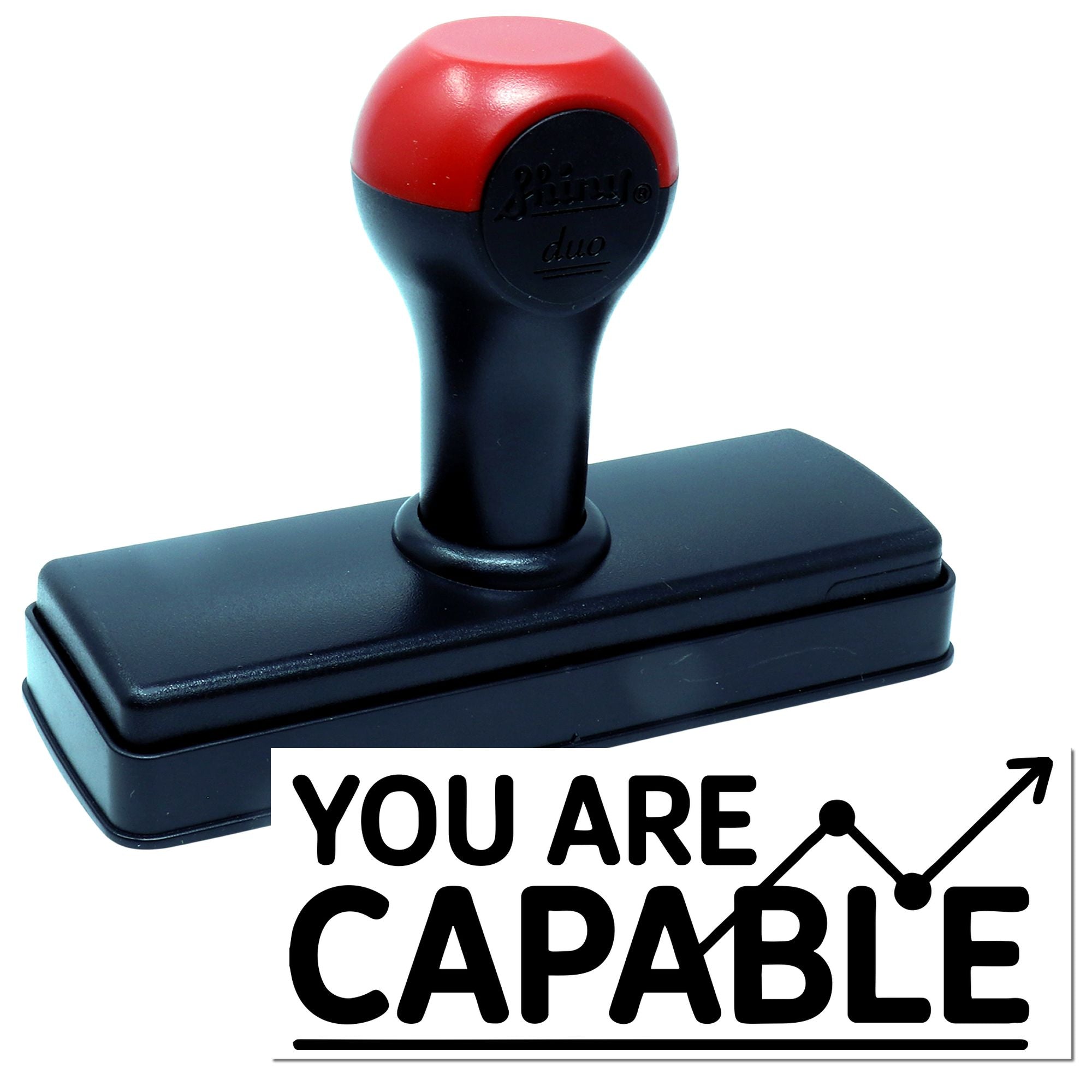 Black and red self-inking stamp with rectangular base and YOU ARE CAPABLE seal impression.