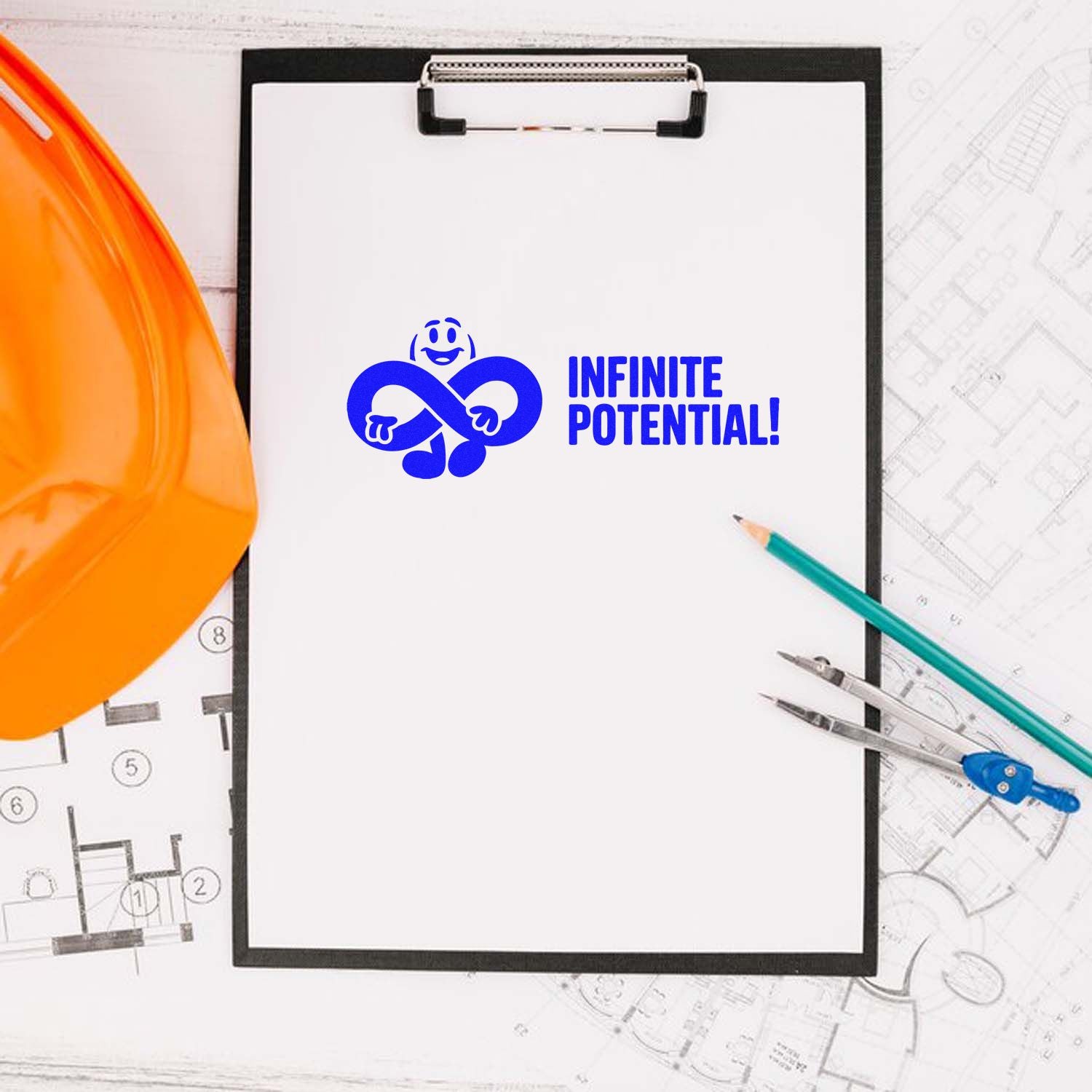 Blue Infinite Potential! stamp seal on clipboard with orange hard hat, pencils, and architectural blueprints.
