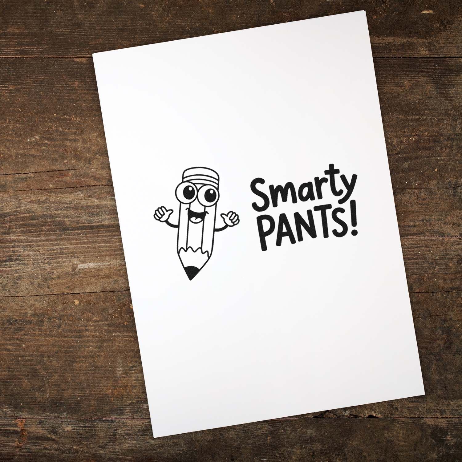 Black rubber stamp/seal reading Smarty PANTS! with a cartoon pencil on white paper over a rustic wood background.