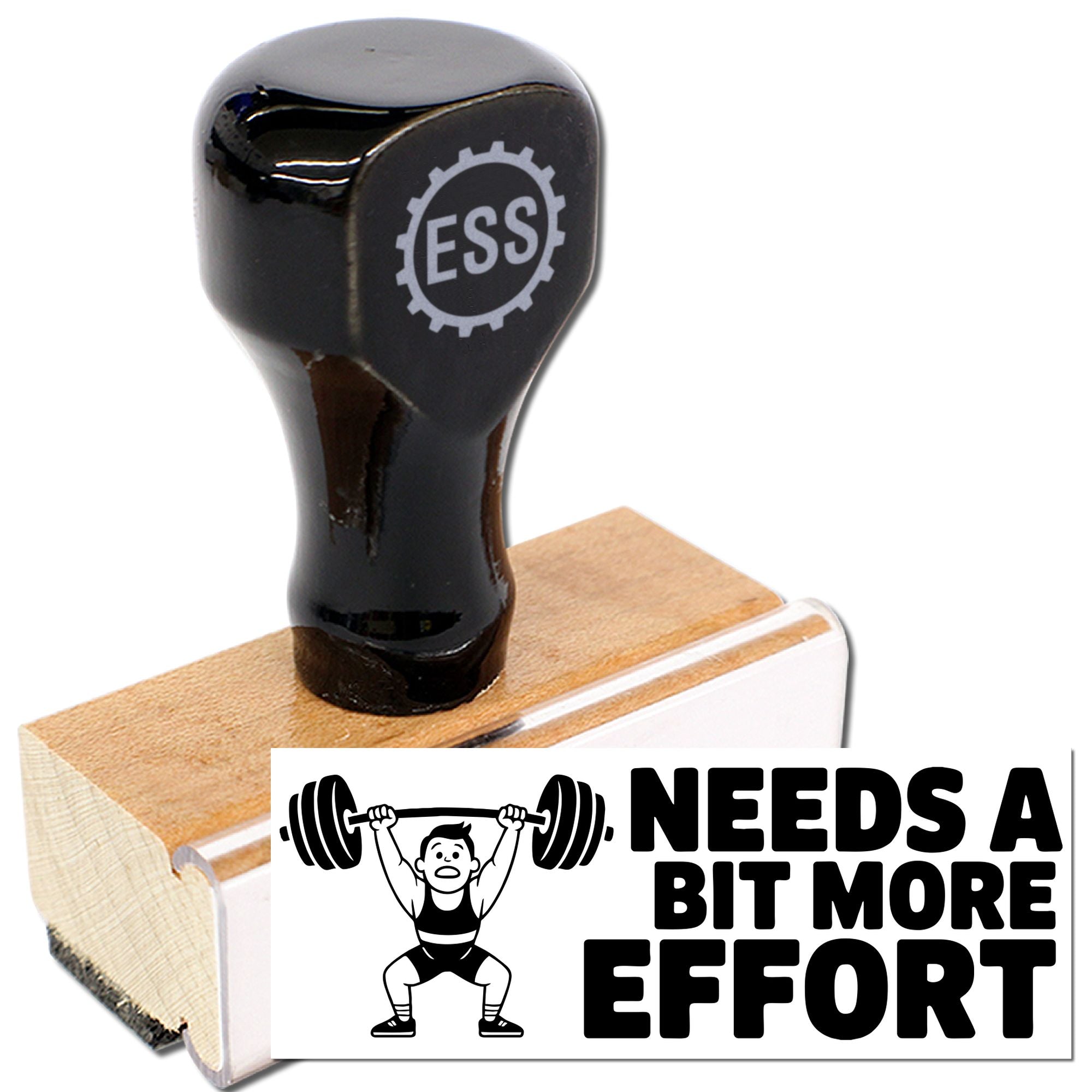Black ESS rubber stamp and seal on wooden base, with weightlifter icon and NEEDS A BIT MORE EFFORT text.