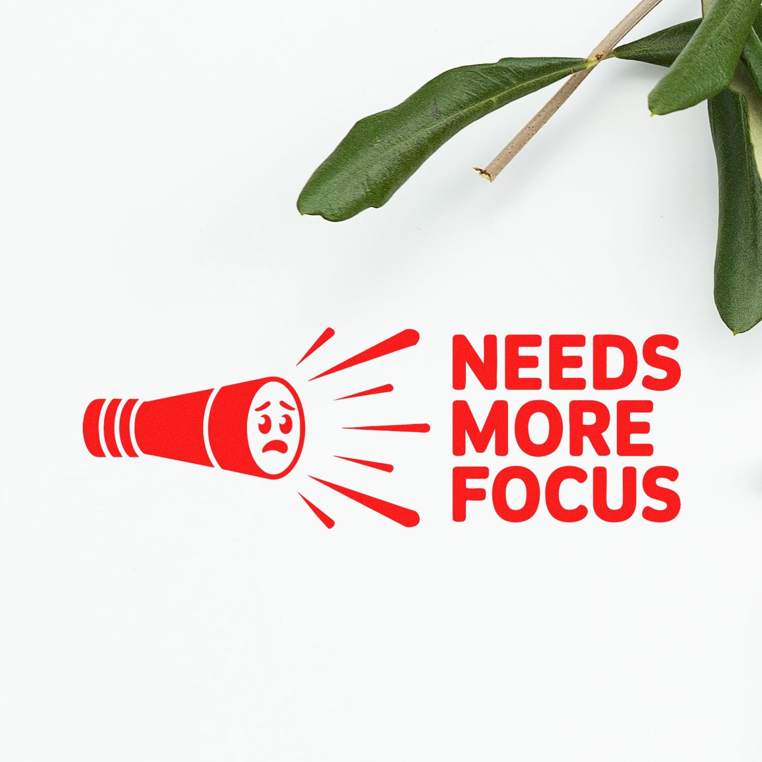Red stamp seal with megaphone icon and Needs More Focus text on white background, accented by green leaves.