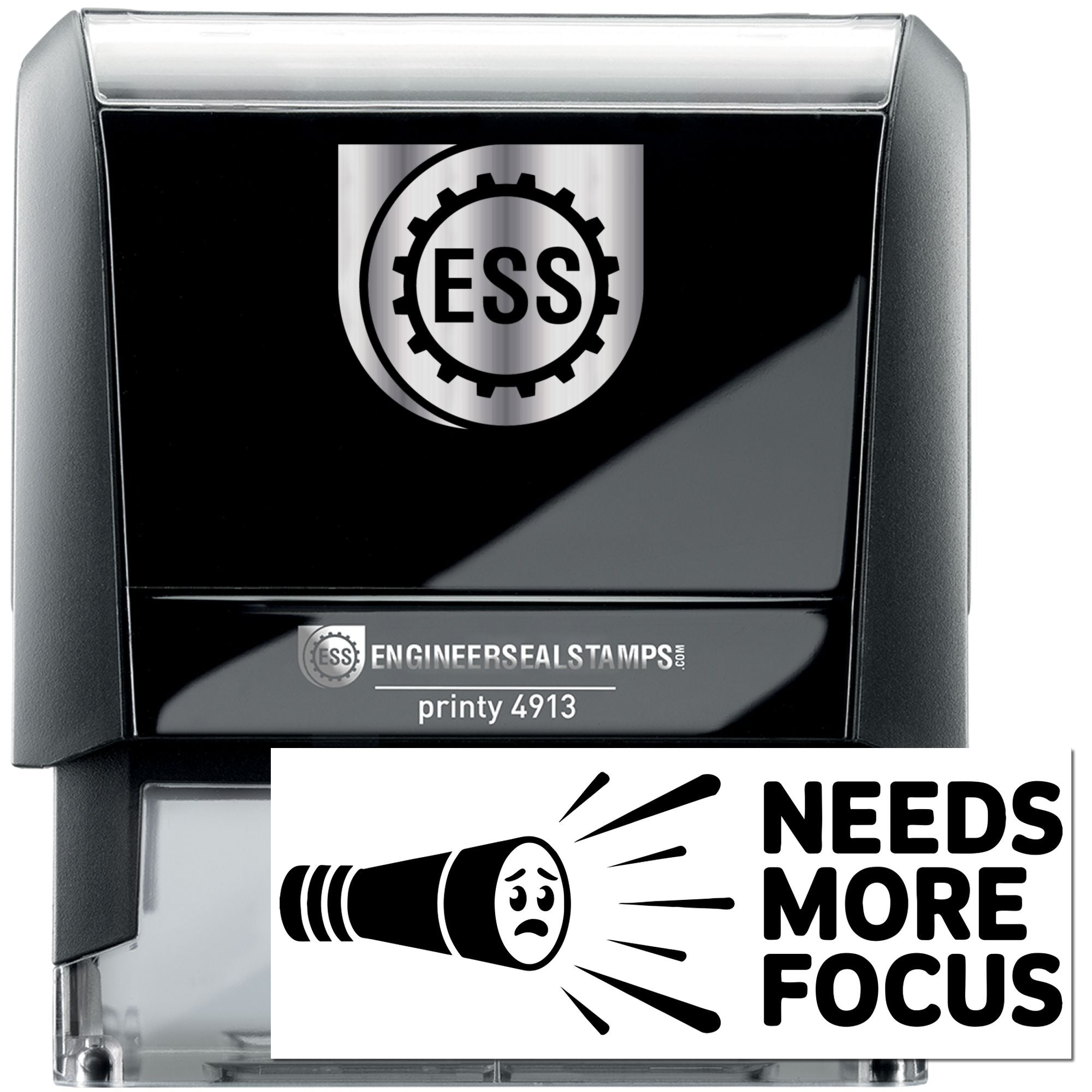 Black self-inking seal stamp with silver accents, ESS logo, and Needs More Focus imprint.