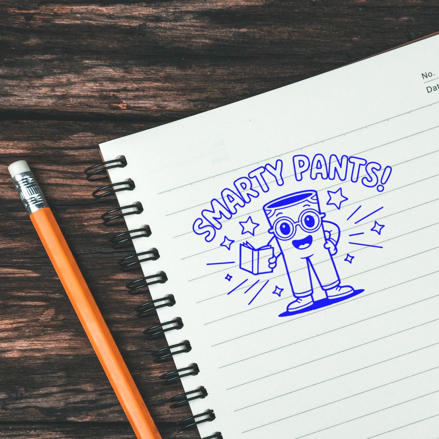 Blue Smarty Pants rubber stamp and seal on a lined notebook, beside an orange pencil on a dark wood desk.
