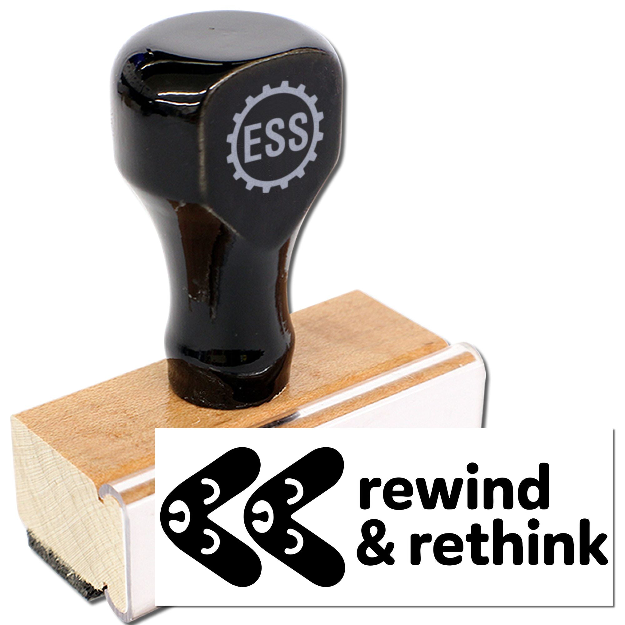 Black ESS stamp and seal handle on a wooden base, with white rewinding & rethink branding.
