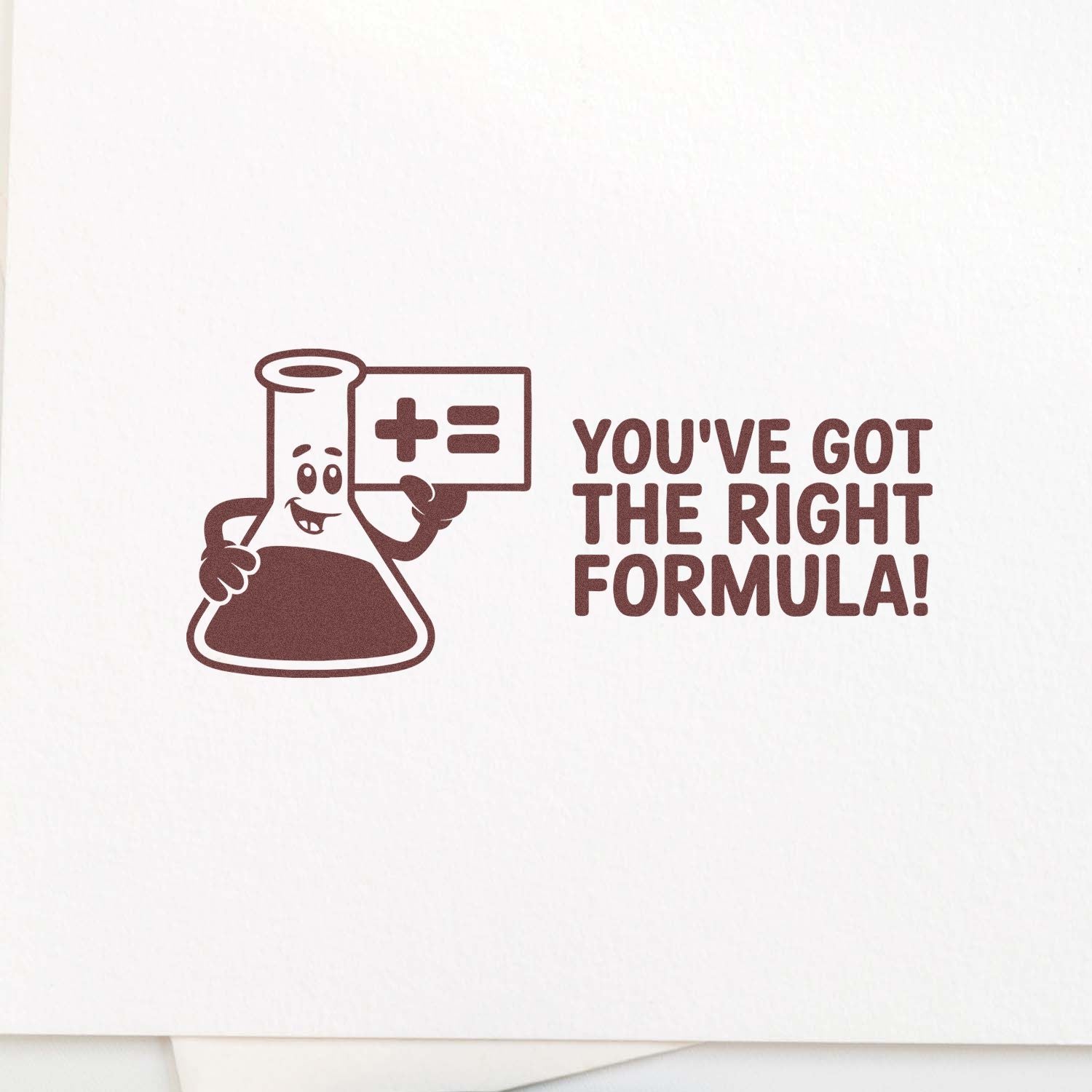 Brown custom stamp/seal design of a smiling lab flask holding a formula sign with Youve got the right formula! on white paper.